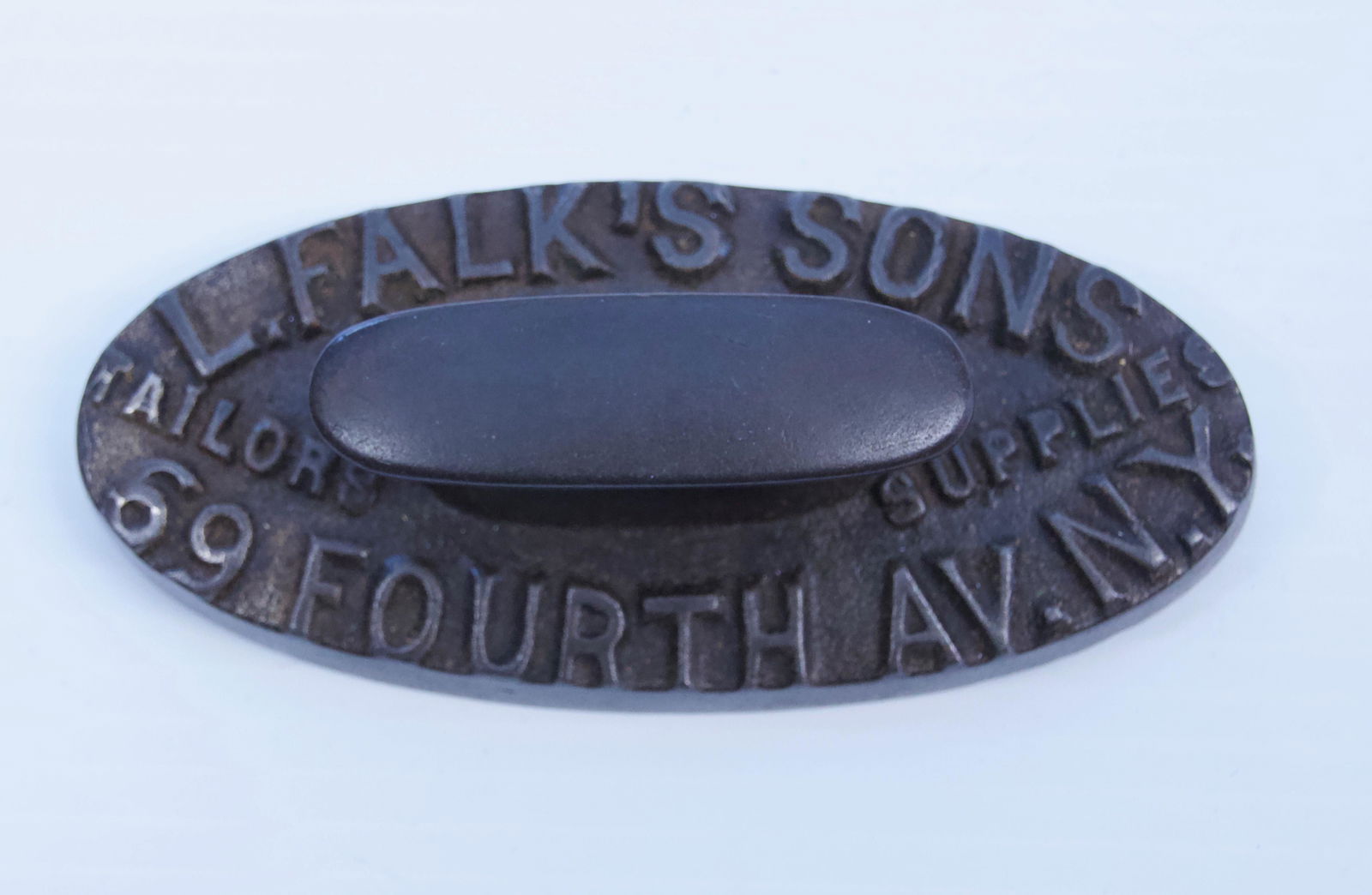 CAST IRON ADVERTISING PAPERWEIGHT: L. FALK'S SONS TAILORS SUPPLIES, FOURTH AVE. NY Dimensions: 5 " X 2 1/4"