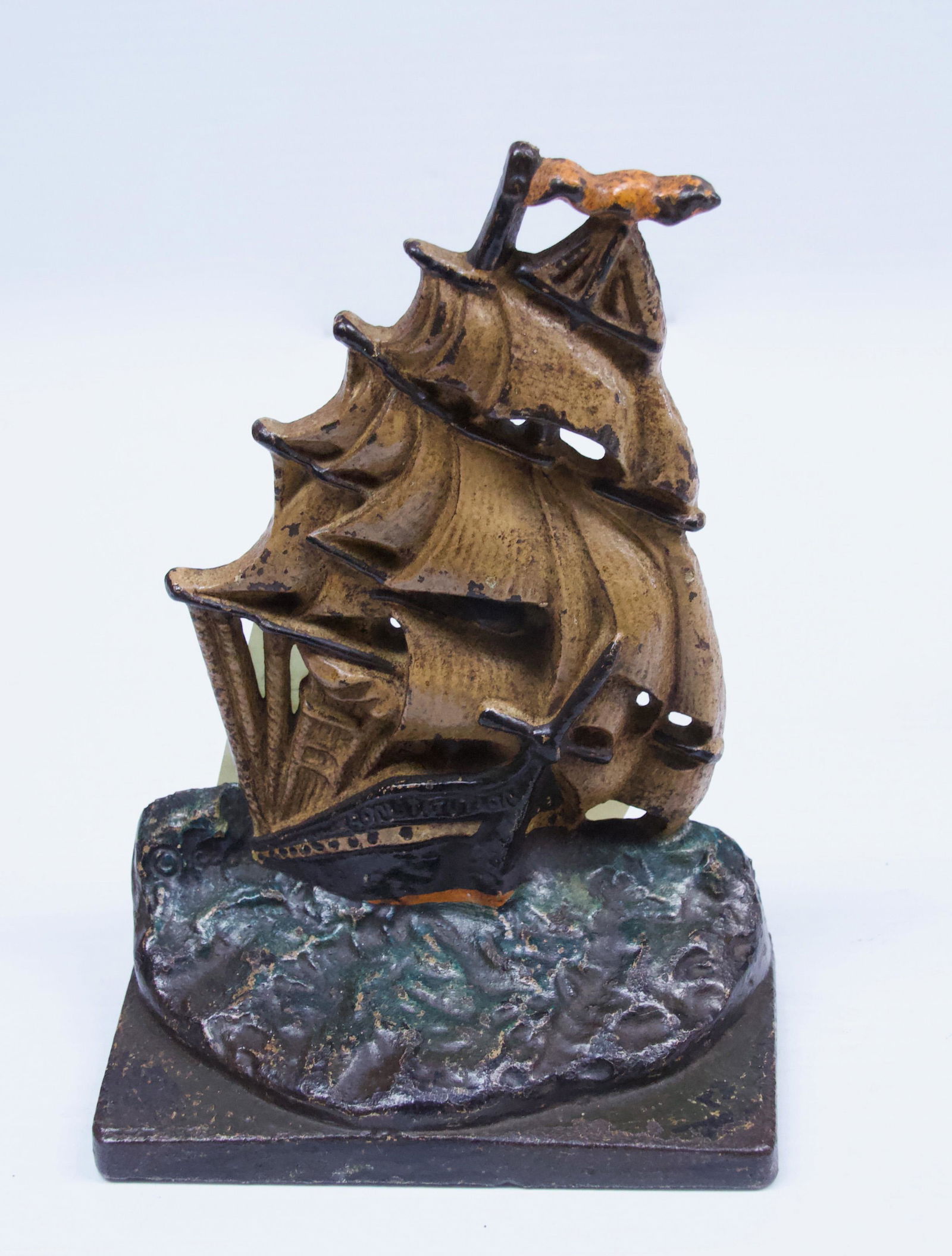 U.S. FRIGATE CONSTITUTION BOOKEND: CIRCA 1925 - A.M. GREENBLATT'S STUDIOS - IN ORIGINAL PAINT WITH INSCRIPTION ON BACK (SEE PHOTO) Dimensions: 6 1/2" H
