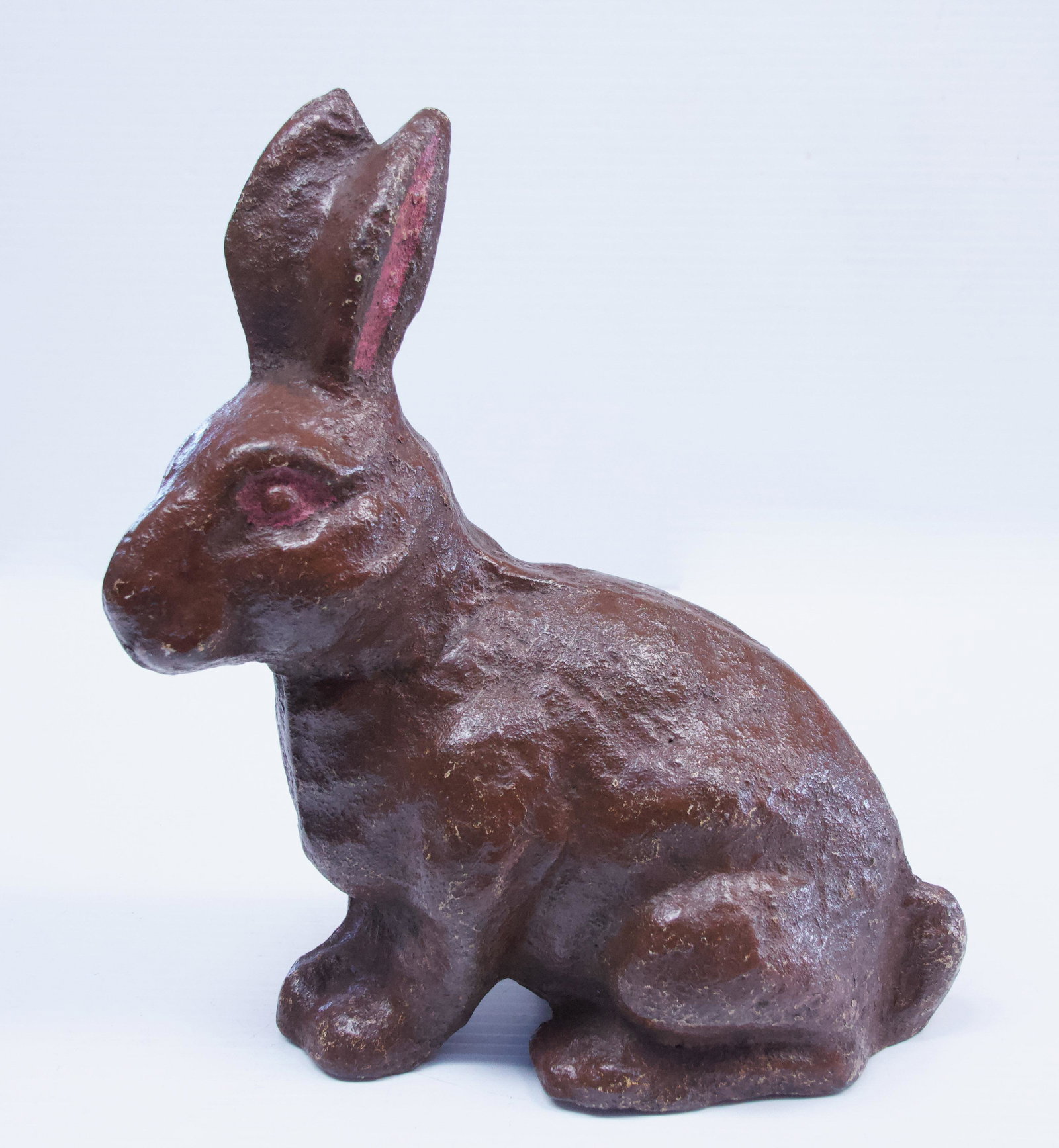 19TH CENTURY CAST IRON RABBIT: CAST IRON DOOR STOP OR LAWN ORNAMENT - PAINTED - WEIGHS 25 POUNDS Dimensions: 11" H