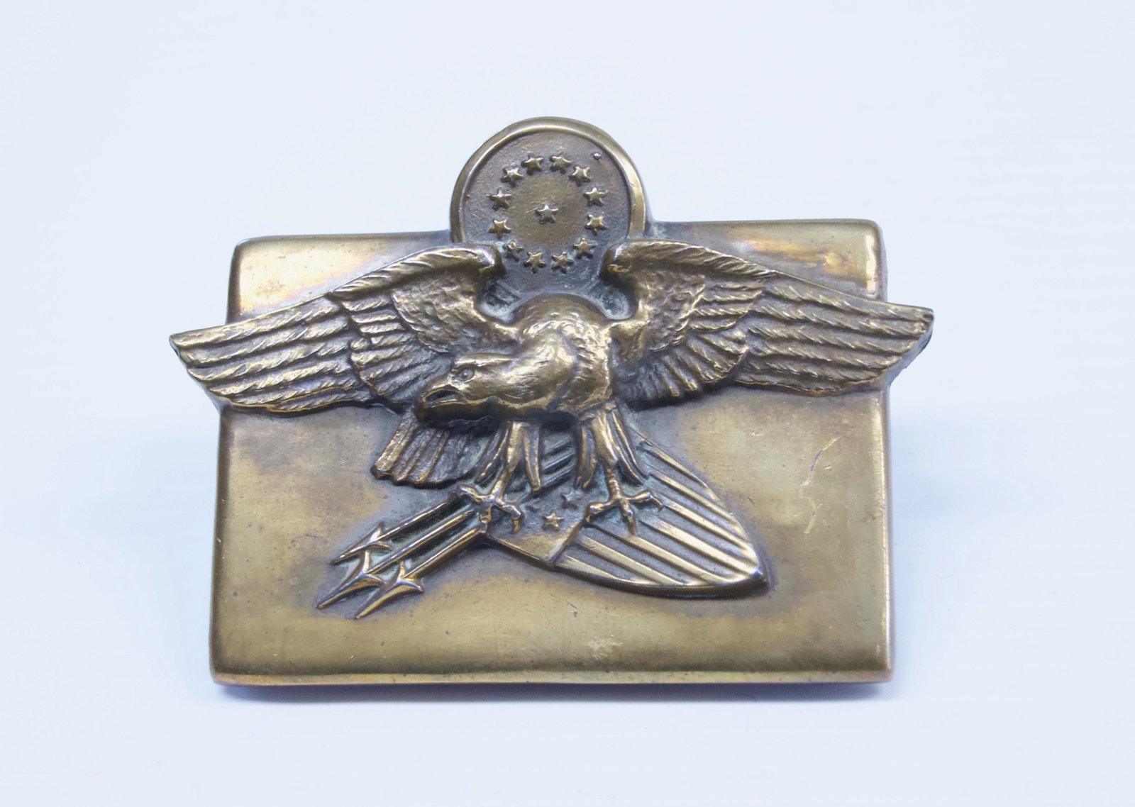 BRASS EAGLE BILL CLIP: EAGLE WITH ARROWS, UNION SHIELD, ARROWS, AND STARS Dimensions: 3 1/2" X 3"
