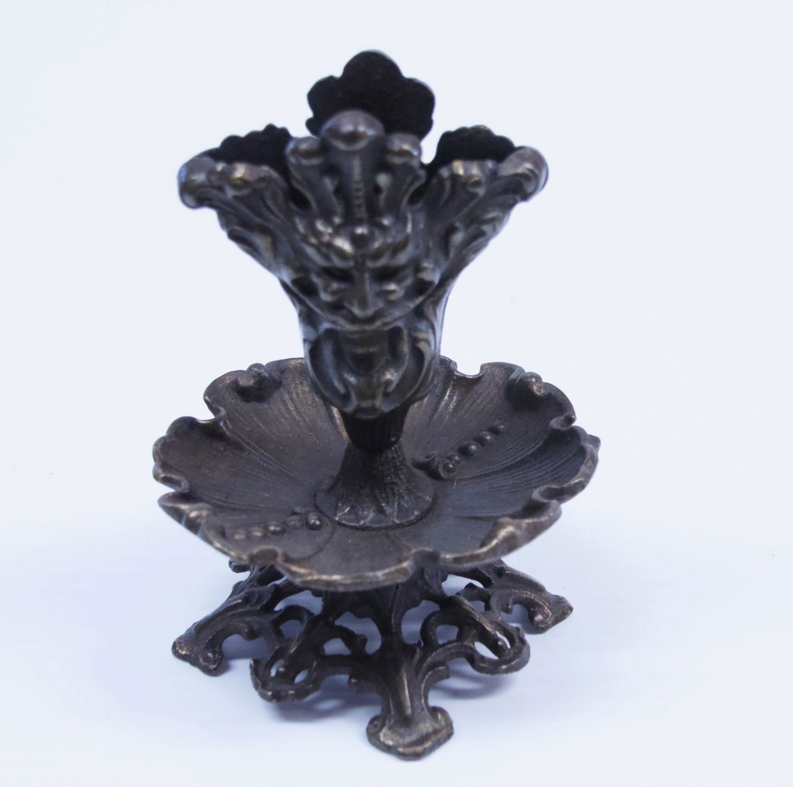 CAST IRON MATCH HOLDER: NORTHWIND MOTIF WITH FLOWER SAUCER UNDER Dimensions: 4 3/4" H