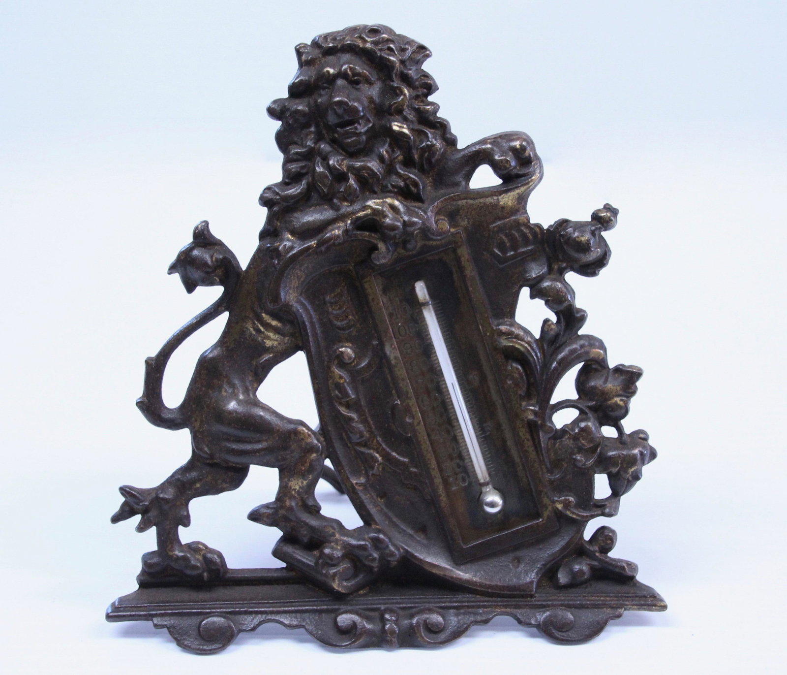BRADLEY & HUBBARD THERMOMETER: PAINTED SURFACE. LION MOTIF Dimensions: 7" X 6 1/2"
