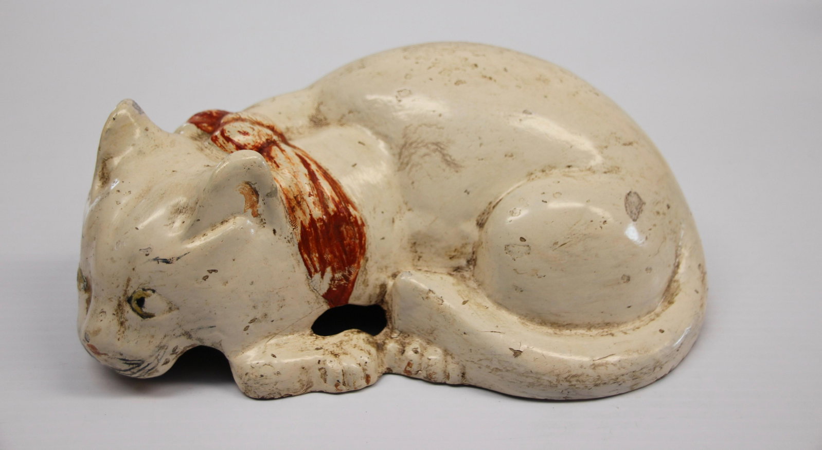 CAST IRON CAT DOORSTOP: HOLLOW BODY PAINTED IRON Dimensions: 3 1/4" X 9 1/2"