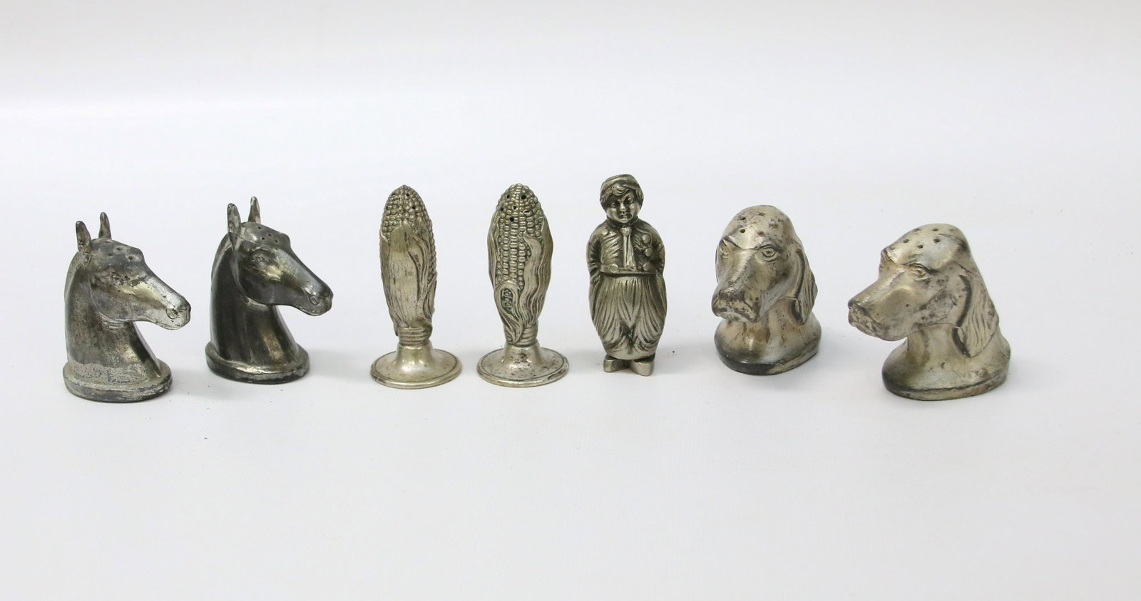 FIGURAL SALT AND PEPPER GROUP: PAIR OF HORSEHEADS, DOG HEADS, MAZE, AND SINGLE DUTCH BOY Dimensions: 2" TO 2 1/2"