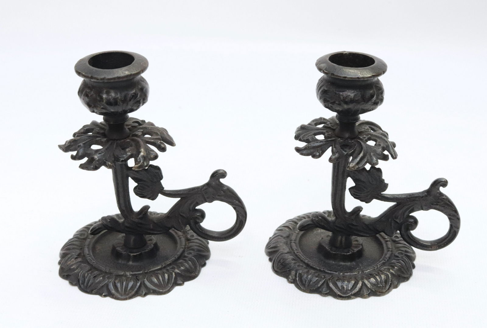 PAIR OF CAST IRON CANDLESTICKS (1 of 3)
