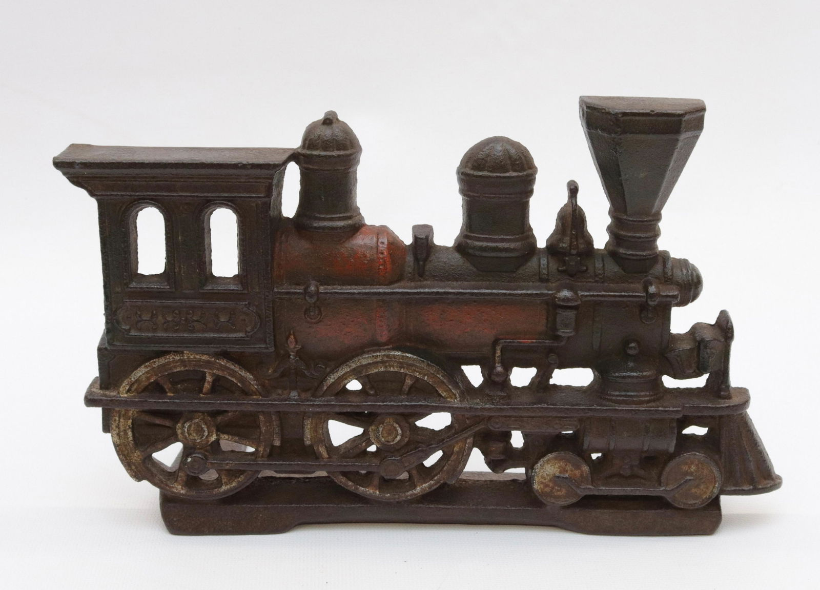 CAST IRON TRAIN DOORSTOP: TRACES OF ORIGINAL PAINT - LATE 19TH EARLY 20TH CENTURY 6 1/2" X 10"