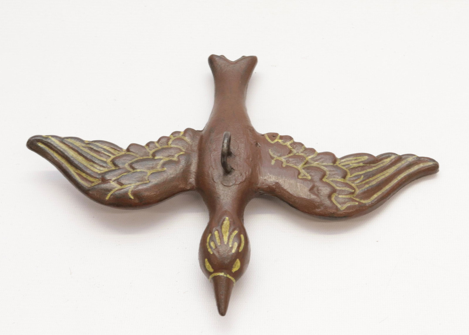 19TH CENTURY CAST IRON GATE WEIGHT: IN THE FORM OF A BIRD - PAINTED SURFACE 11" X 8"