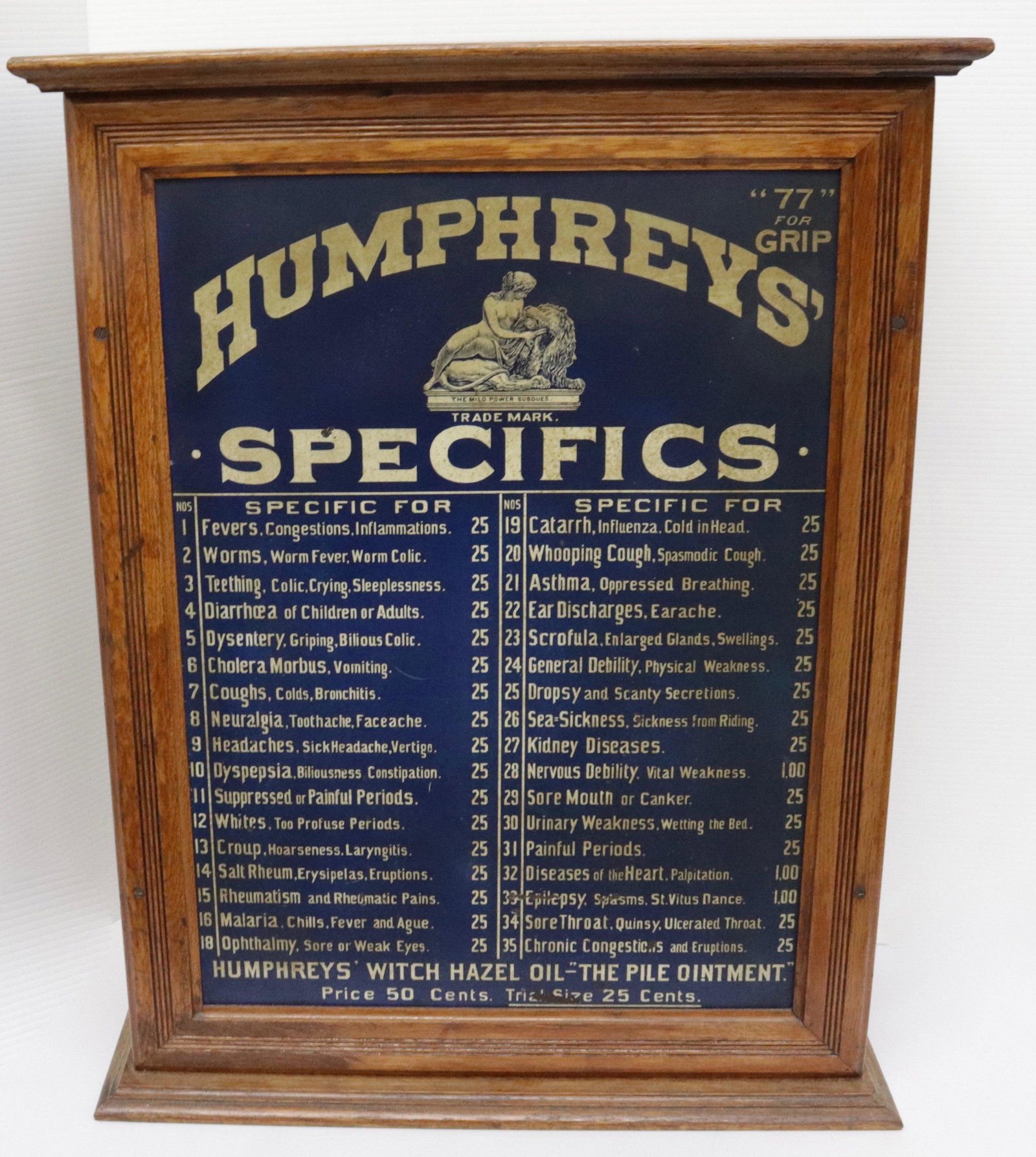 VINTAGE ADVERTISING MEDICINE CABINET: HUMPHREYS' WITCH HAZEL - DOOR OPENS WITH 34 INTERIOR DRAWERS - TIN PANEL LISTING ALL CONTENTS 28" H X 22" X 10"