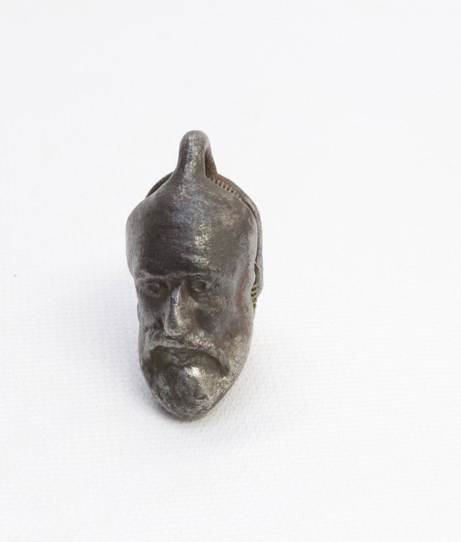 19TH CENTURY CAST IRON CAP BOMB: IN THE FORM OF BEARDED MAN 1 1/2"