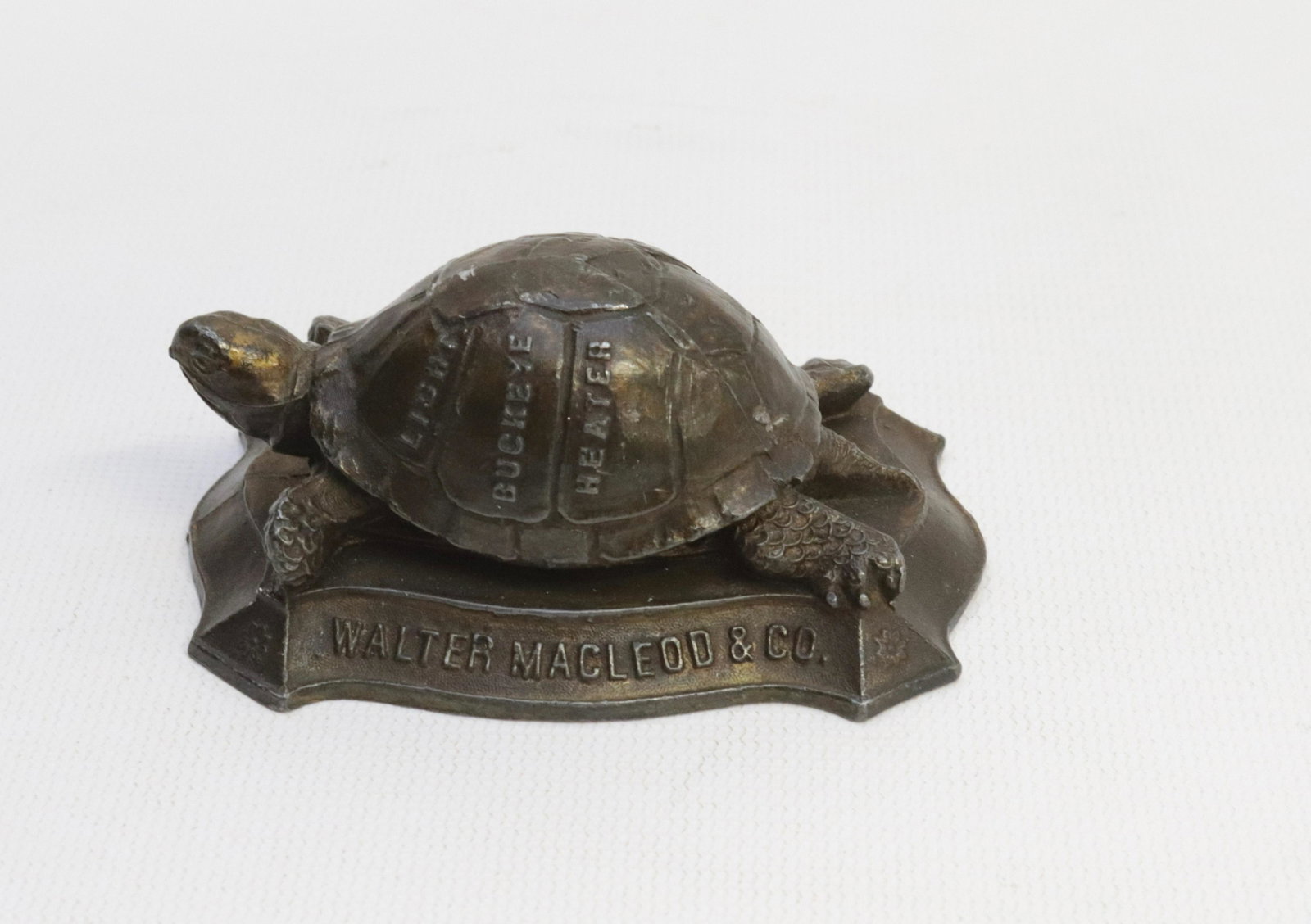 CAST IRON ADVERTISING TURTLE PAPER WEIGHT: IN THE FORM OF A TURTLE - WALTER MACLEOD AND CO. CINCINNATI, OHIO - BUCKEYE HEATERS 3 1/2"