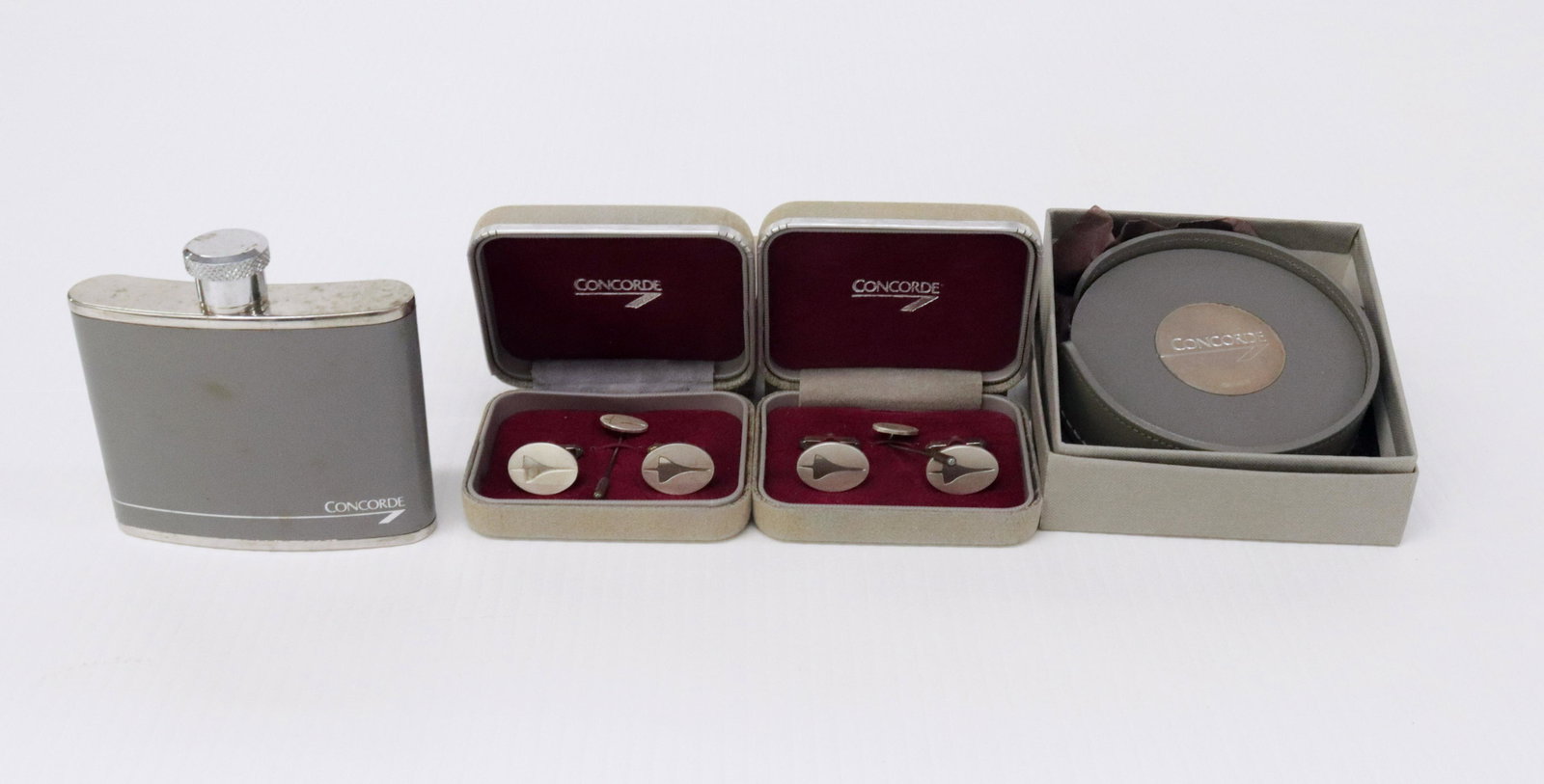 CONCORDE LOT: (2) SETS OF STERLING SILVER - CUFFLINKS, STICK PIN, AND COASTERS WITH STERLING - STAINLESS STEEL FLASK Dimensions: 3 3/4" X 3 3/4"