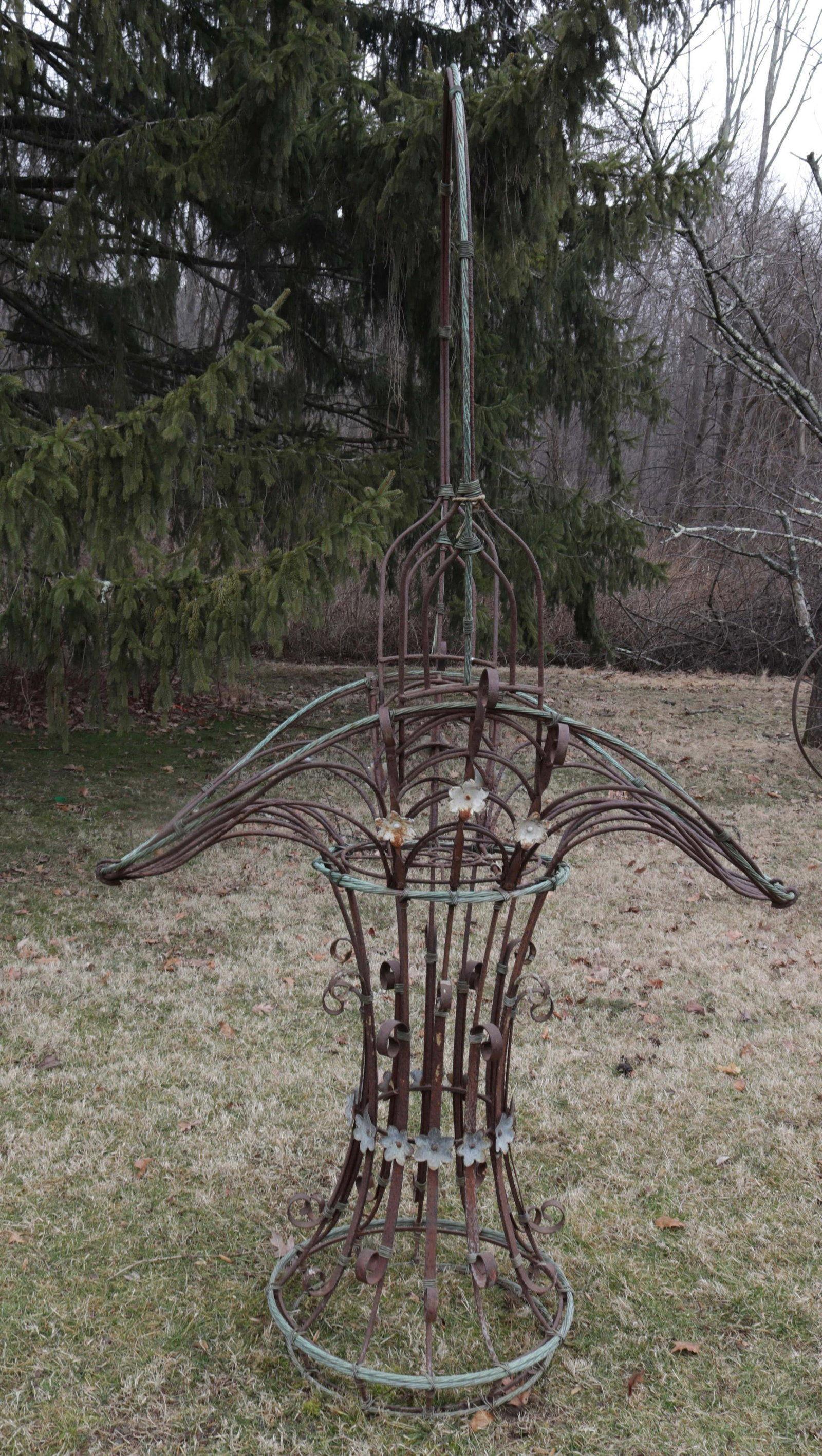 LARGE IRON GARDEN BASKET: IRON WITH COPPER WIRING AND METAL FLORETS. MRKD. BRAD OLIVER Dimensions: 94" H