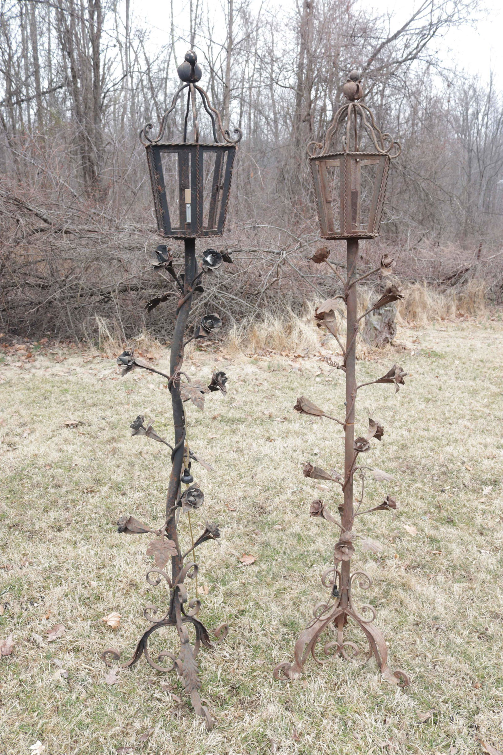 PAIR OF WROUGHT IRON GARDEN LANTERNS: WROUGHT AND TWISTED IRON WITH ROSETTES Dimensions: 74" H
