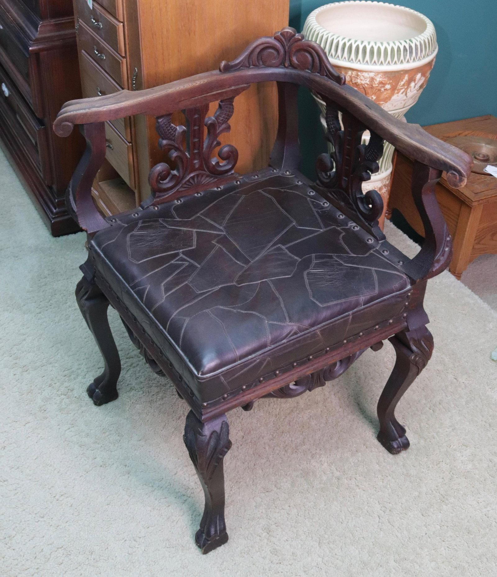 CARVED WOODEN CORNER CHAIR: LEATHER A TACK SEAT SIZE: 31" X 19" X 19"
