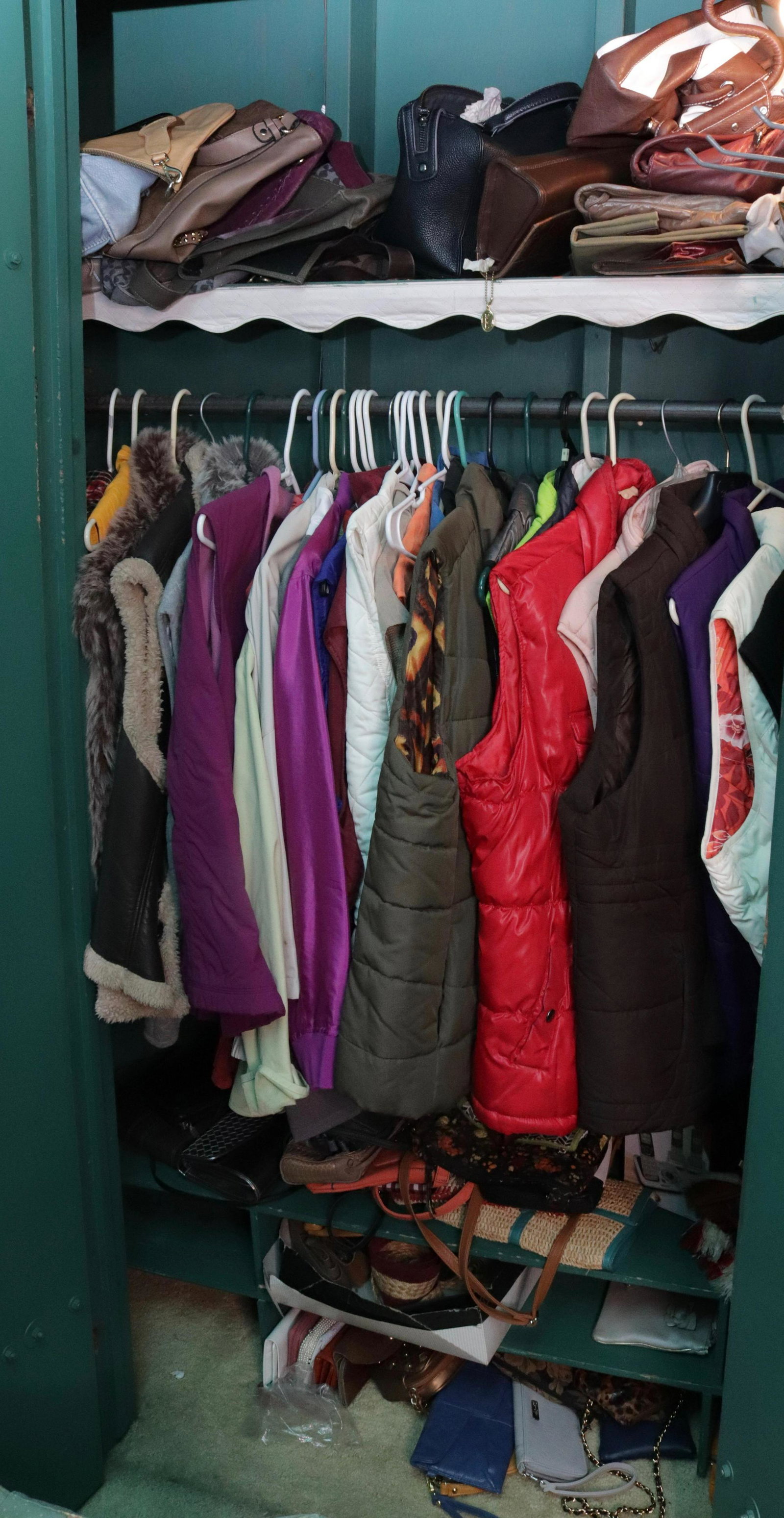 CONTENTS OF BEDROOM CLOSET: PURSES, JACKETS, VESTS, SCARVES, AND MORE