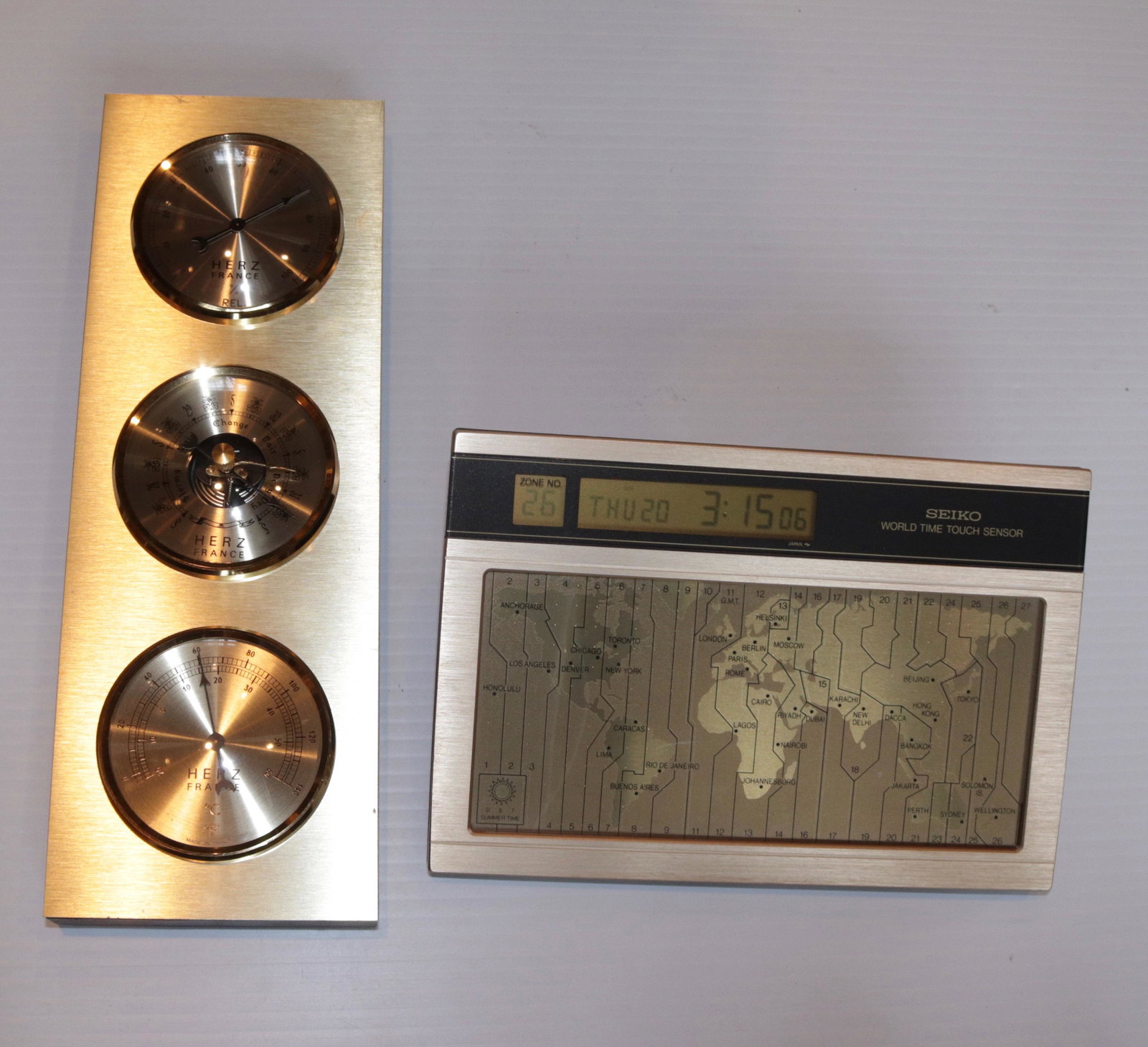 SEIKO WORLD CLOCK AND WEATHER CENTER: WEATHER CENTER BY; HERZ, FRANCE SIZE: 7 1/2" X 5" - WEATHER CENTER 11" H