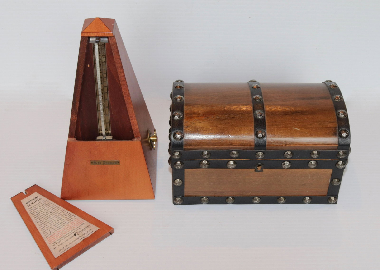 PAIR OF DECORATOR ITEMS: SETH THOMAS METRONOME - TREASURE CHEST SHAPED JEWELRY BOX SIZE: 5" AND 8 1/2" H