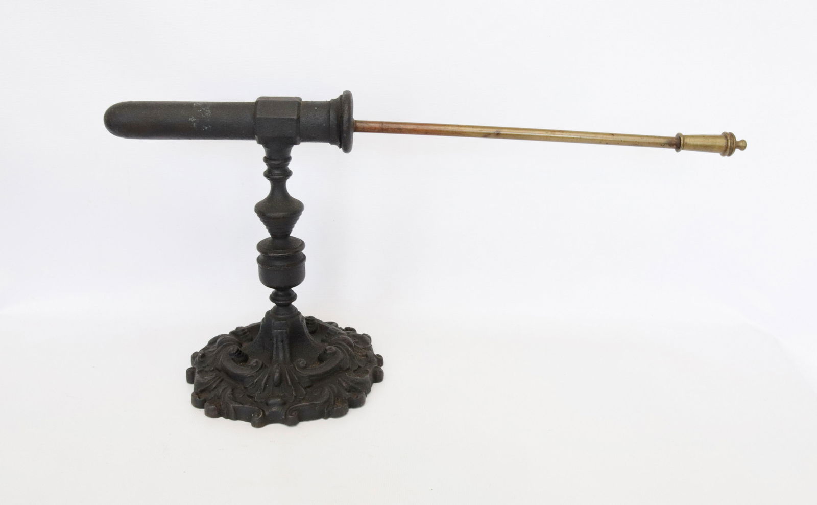 CAST IRON GOFFERING IRON: SINGLE GOFFERING IRON WITH ELABORATE BASE, POKER, AND BULBOUS STEM DIMENSIONS: 7"