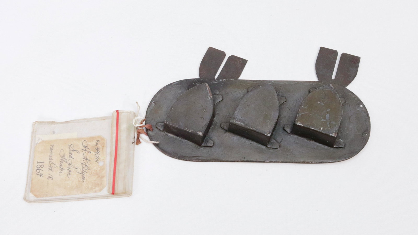 PATENT MODEL IRON HEATER: H. W. BLYER" BUFFALO, NEW YORK - 1864 - HOLDS 3 IRONS - WITH ORIGINAL TAG DIMENSIONS: 10