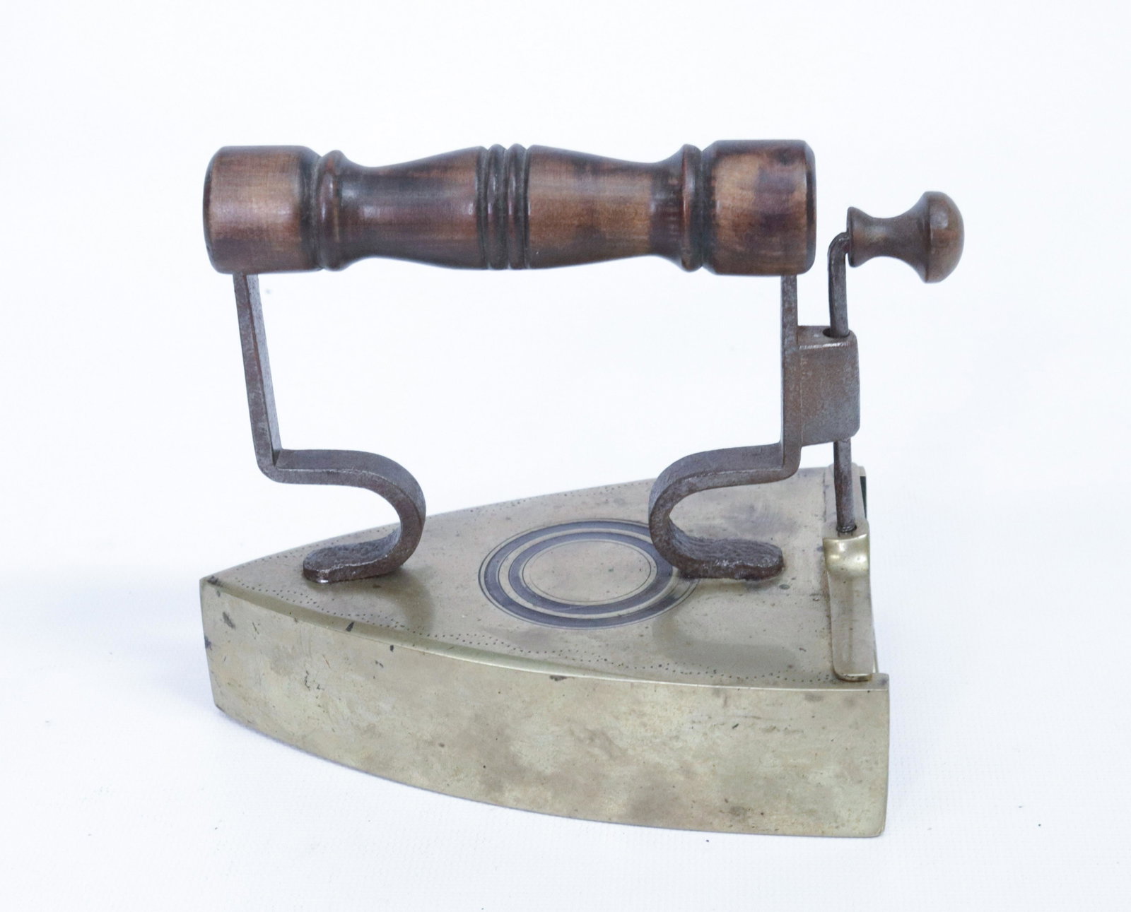 BRASS SLUG IRON: CIRCLE DESIGN - "L. ELIASON" DIMENSIONS: 5 1/2"