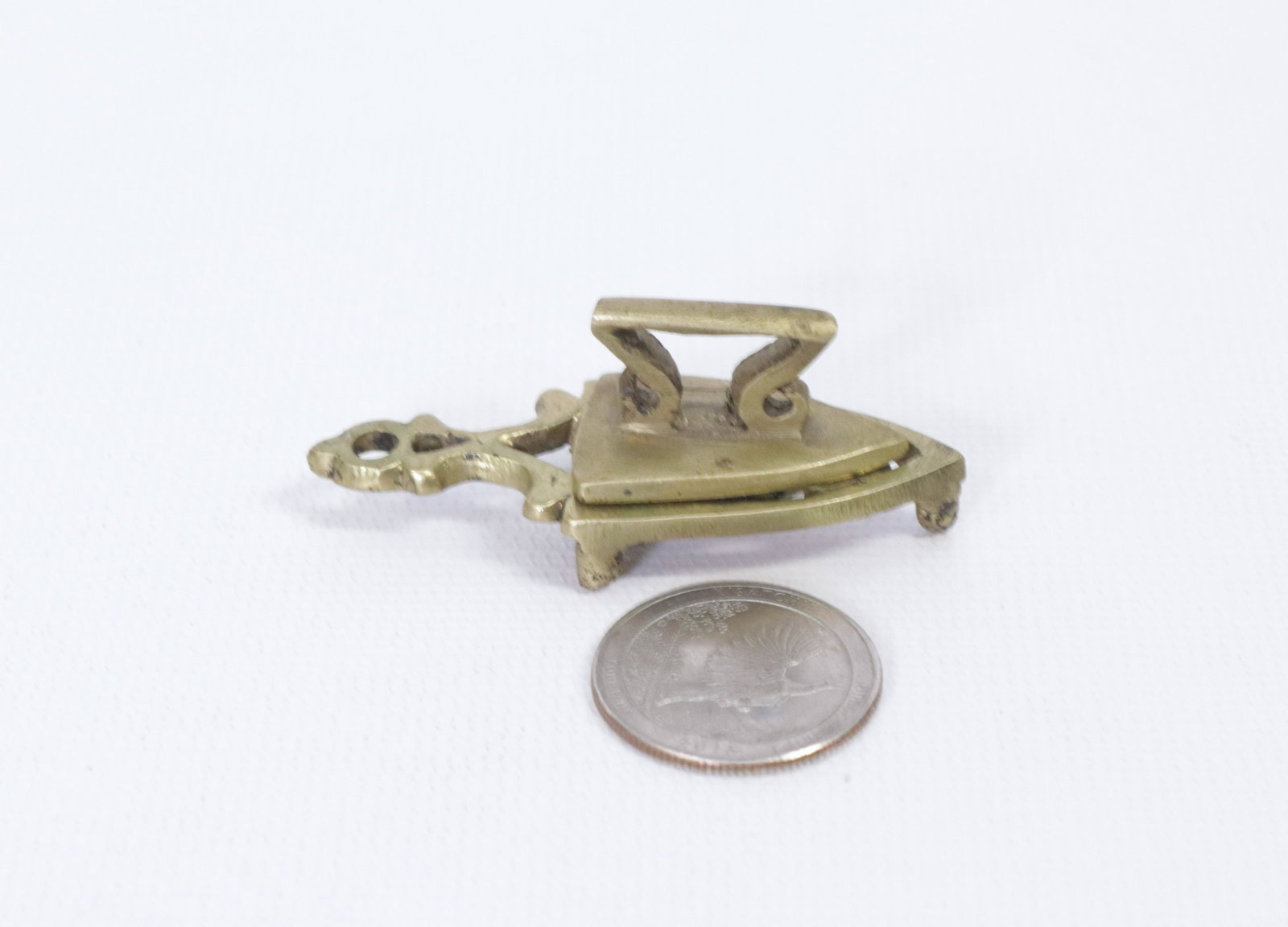 BRASS MINIATURE IRON: MINIATURE SAD IRON WITH TRIVET DIMENSIONS: 1"