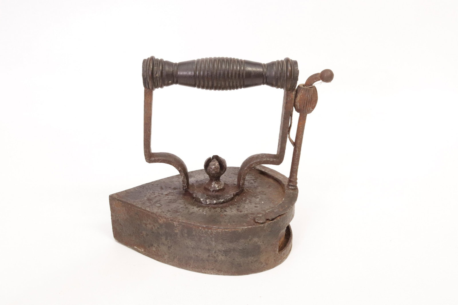 ROUND BACK SLUG IRON: HAND MADE SLUG IRON - CENTER FINIAL AND ROSETTE DIMENSIONS: 6 1/2"