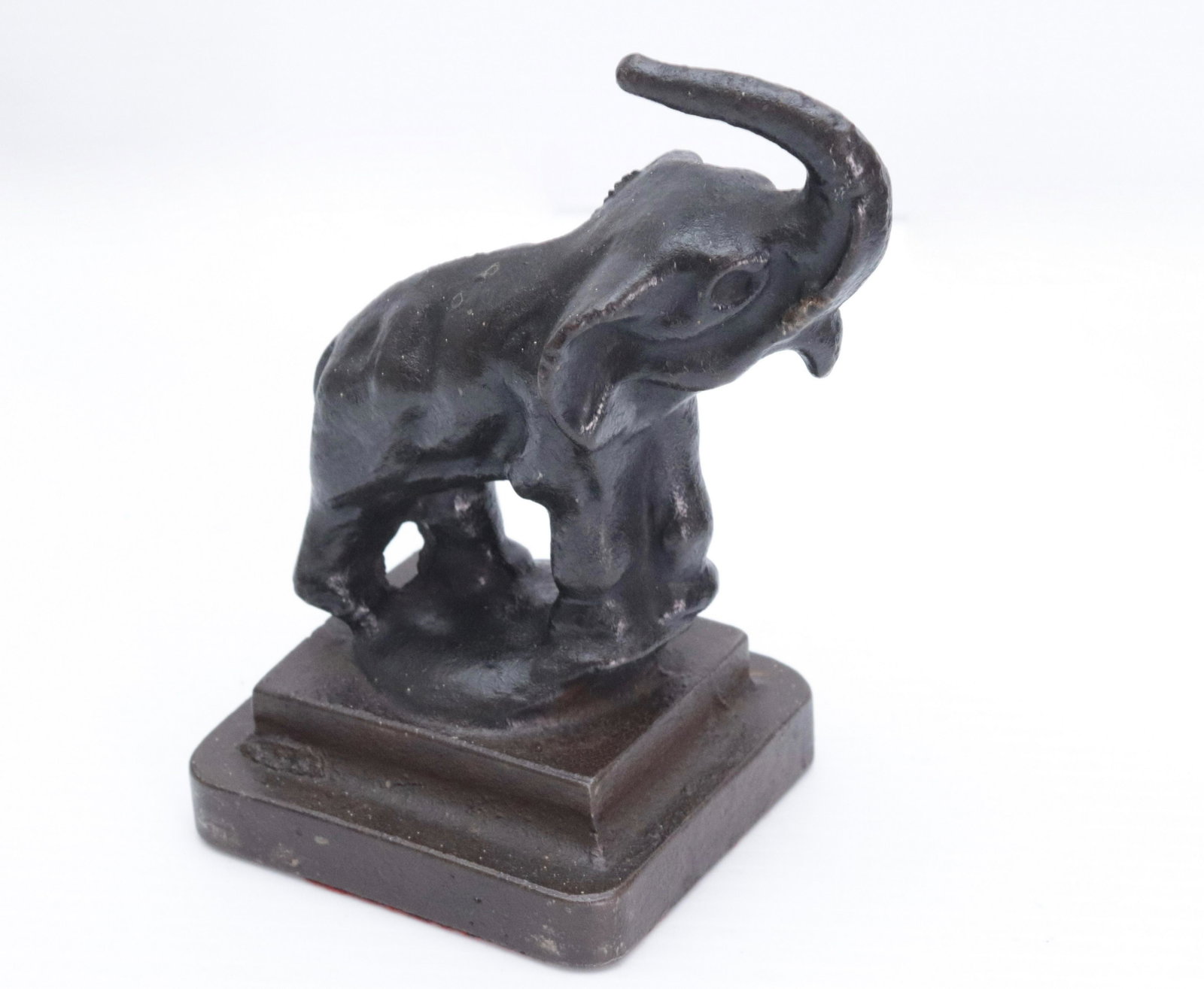 CAST IRON ELEPHANT DOORSTOP: PAINTED BLACK AND BROWN 5 3/4" X 3 1/2"