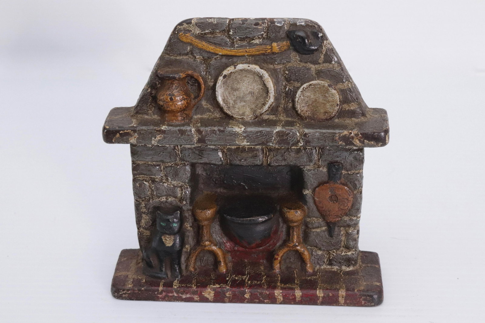 CAST IRON FIREPLACE DOORSTOP: DEPICTS FIREPLACE WITH BLACK CAT 5 1/2" H