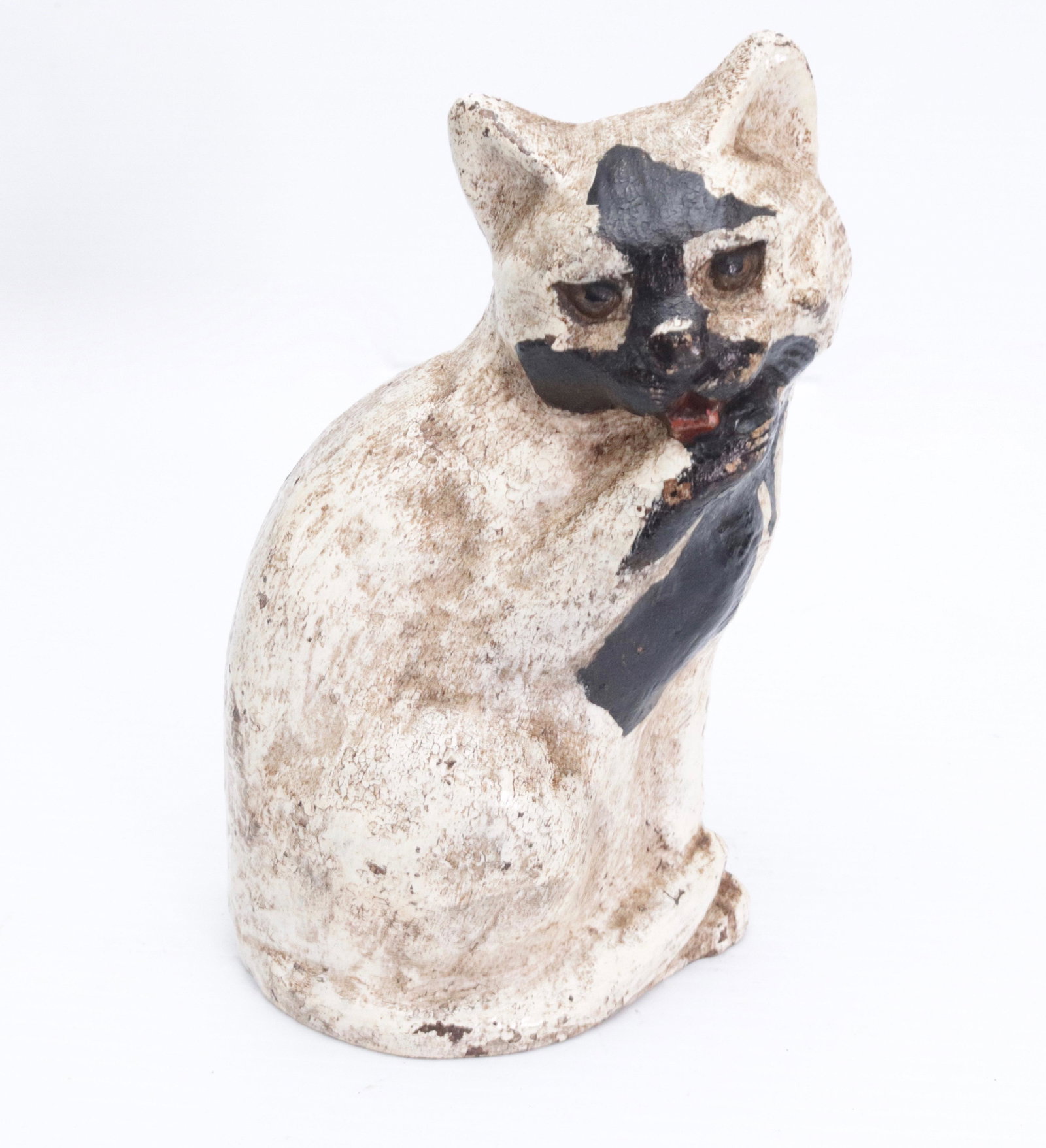 CAST IRON CAT DOORSTOP: CAT LICKING PAW. PAINTED SURFACE. MRKD. WAVERLY STUDIO, WILMETTE, ILL 1926 7 1/2" H