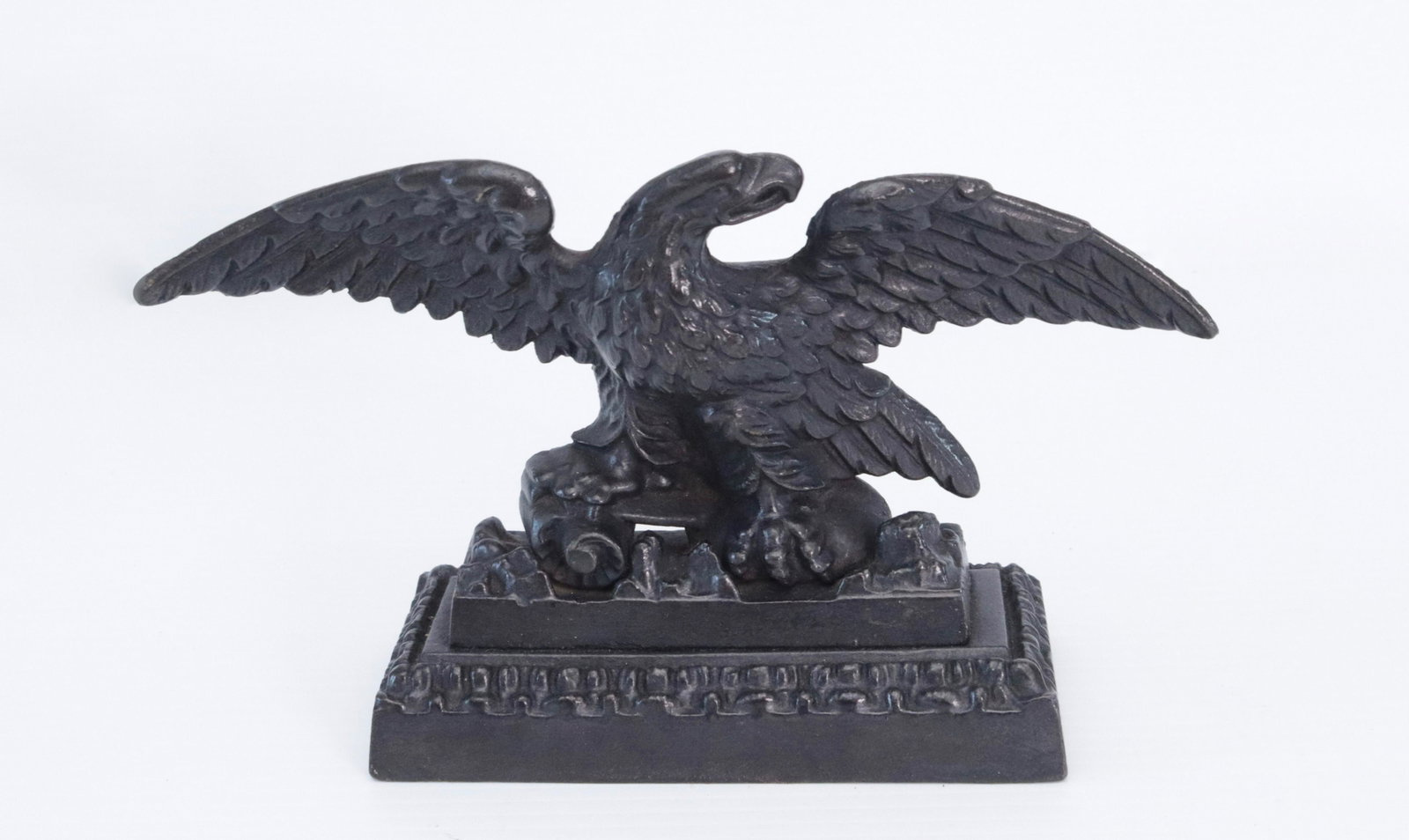 CAST IRON EAGLE DOORSTOP: BLACK PAINTED SURFACE. SCREWED TO BASE 5 1/2" X 9 1/2"