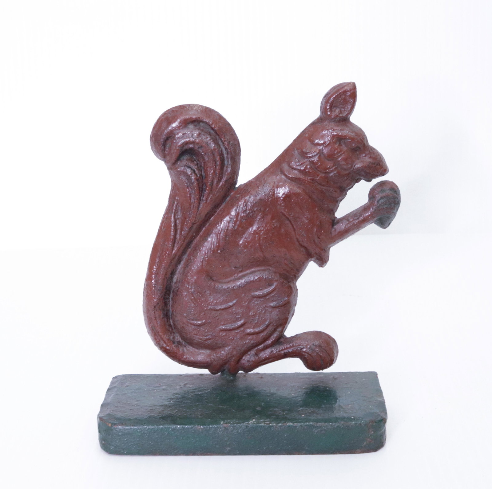 CAST IRON PAINTED DOOR STOP: IN THE FORM OF A SQUIRREL WITH NUT 7 1/2" X 6"