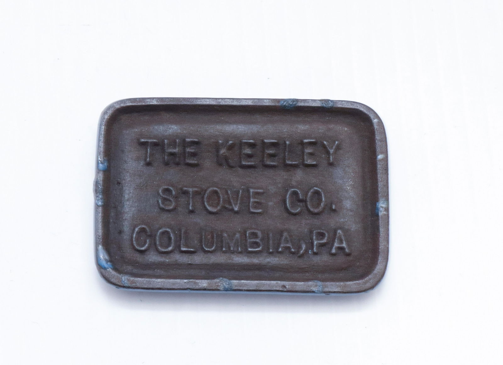 CAST IRON STOVE ADVERTISEMENT: KEELY STOVE CO. COLUMBIA, PA" - ENAMEL OVER IRON 2" X 3