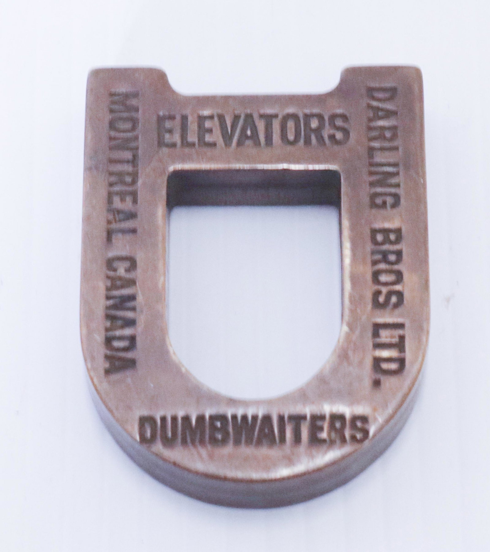 BRASS ADVERTISING PAPERWEIGHT: DARLING BROTHERS ELEVATORS, DUMBWAITERS - MONTREAL, CANADA" 2" X 2 1/2