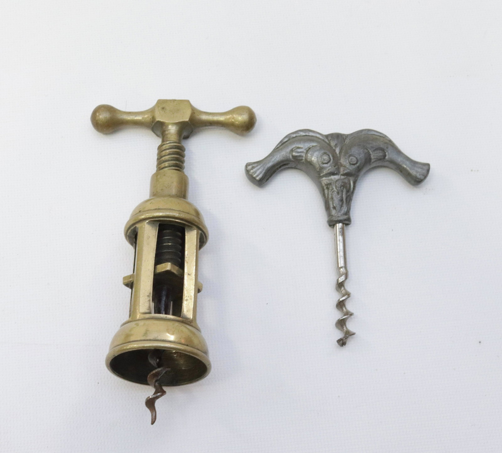 PAIR OF CORKSCREWS: BRASS MECHANICAL AND FISH MOTIF MANUAL 4" TO 5 1/2"