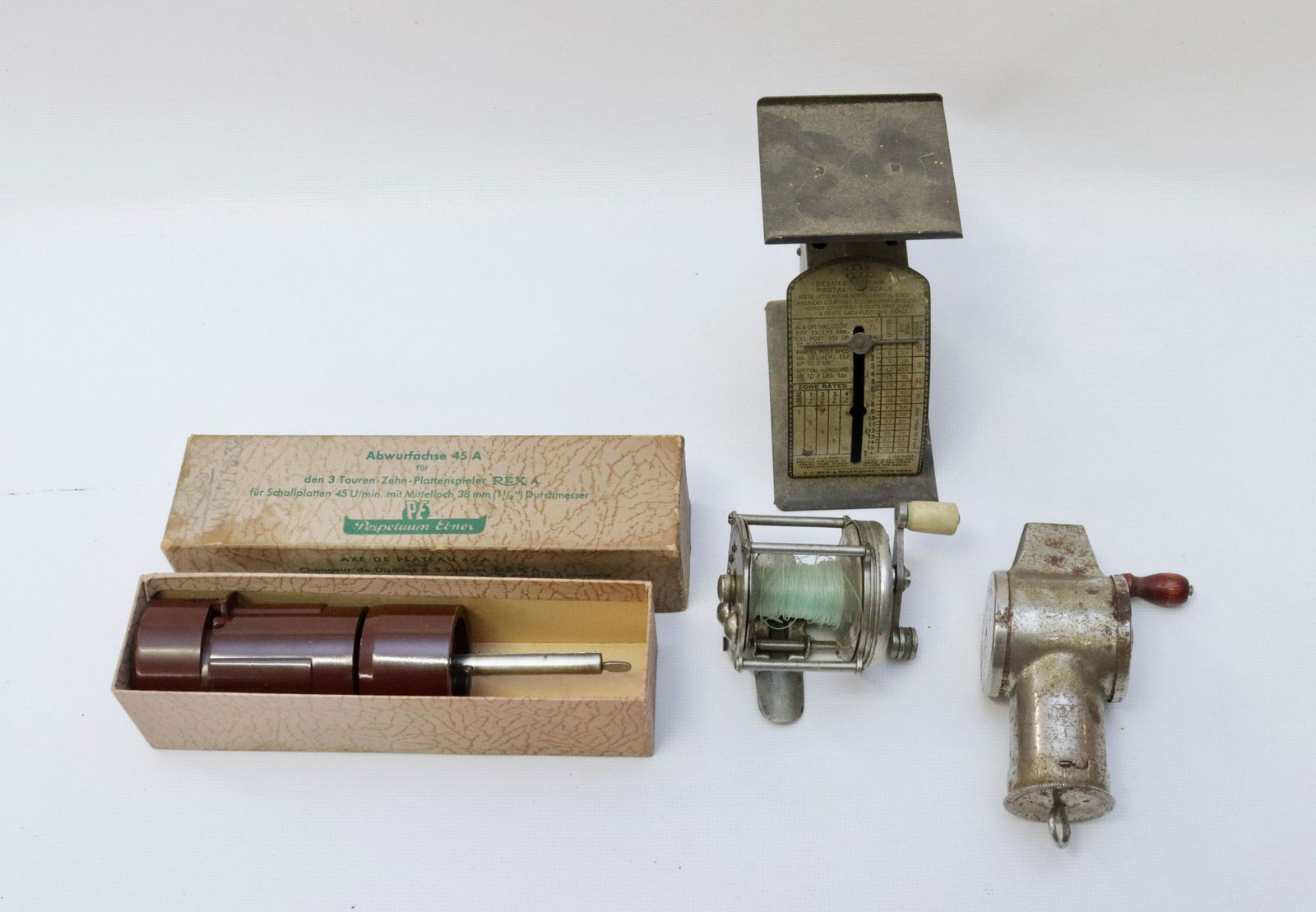 GROUP LOT OF VINTAGE SMALLS: INCLUDING: POSTAL SCALE, FISHING REEL, NUTMEG GRATER AND W.GERMAN RECORD SPINDLE SCALE 4" H