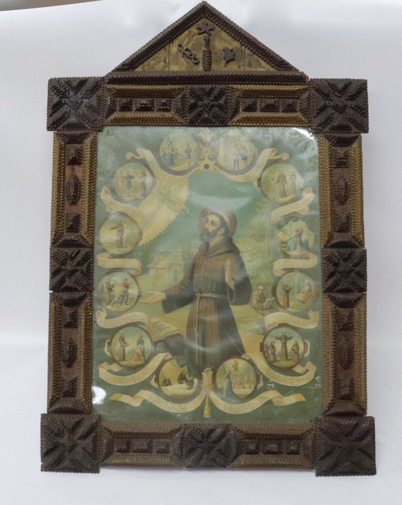 TRAMP ART CARVED FRAME: LIGHT AND DARK COLOR CHIP CARVING SURROUNDING MONK PRINT TOTAL SIZE 27" X 17"