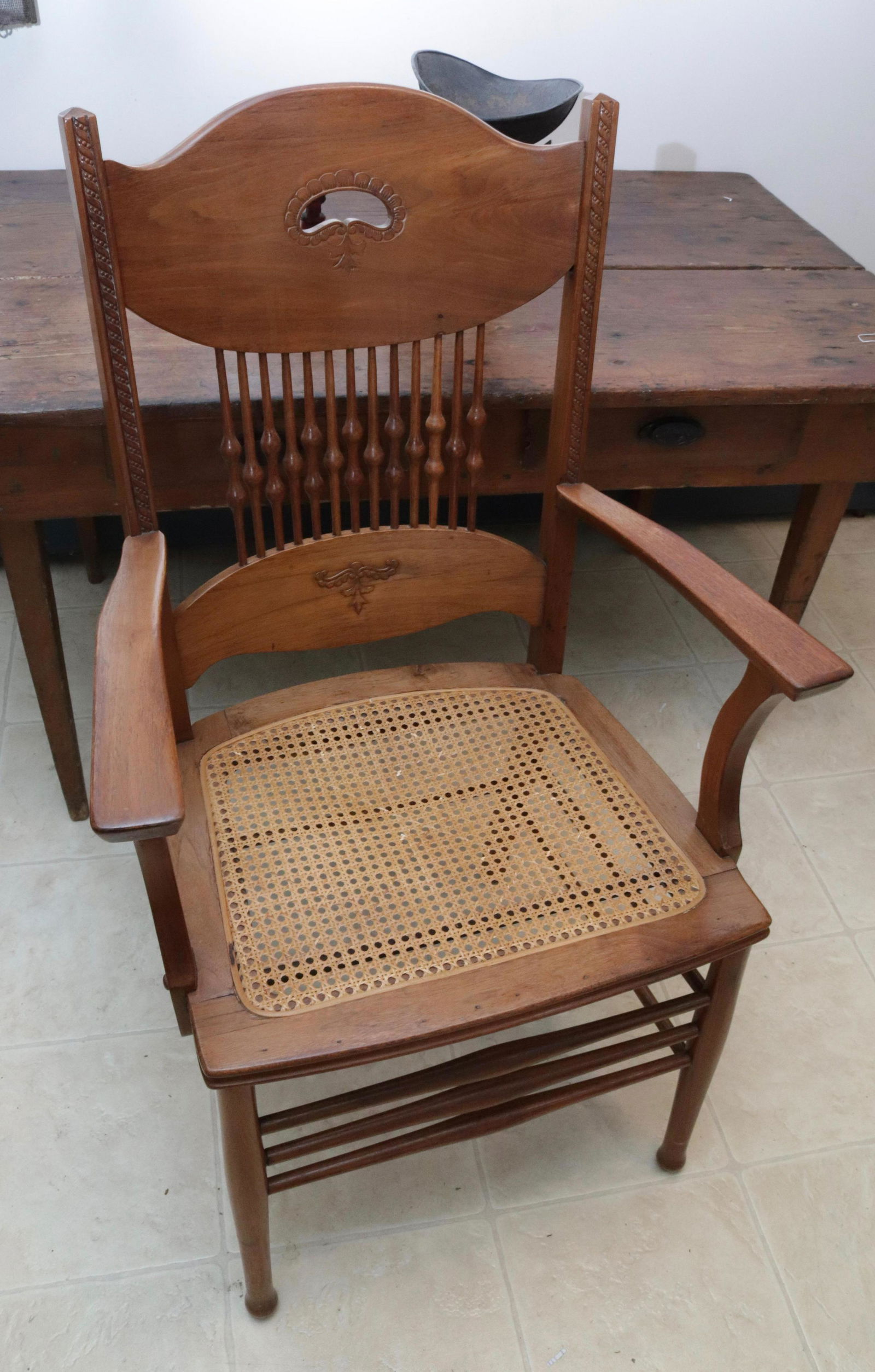 ANTIQUE OAK ARMCHAIR: CANED SEAT. REFINISHED 41" H X 25" X 19"