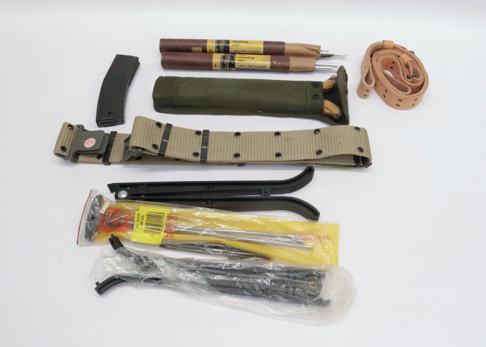 GUN RELATED ITEM LOT: CLIPS, TRI-PODS, SLINGS, CLEANING RODS, AND MORE