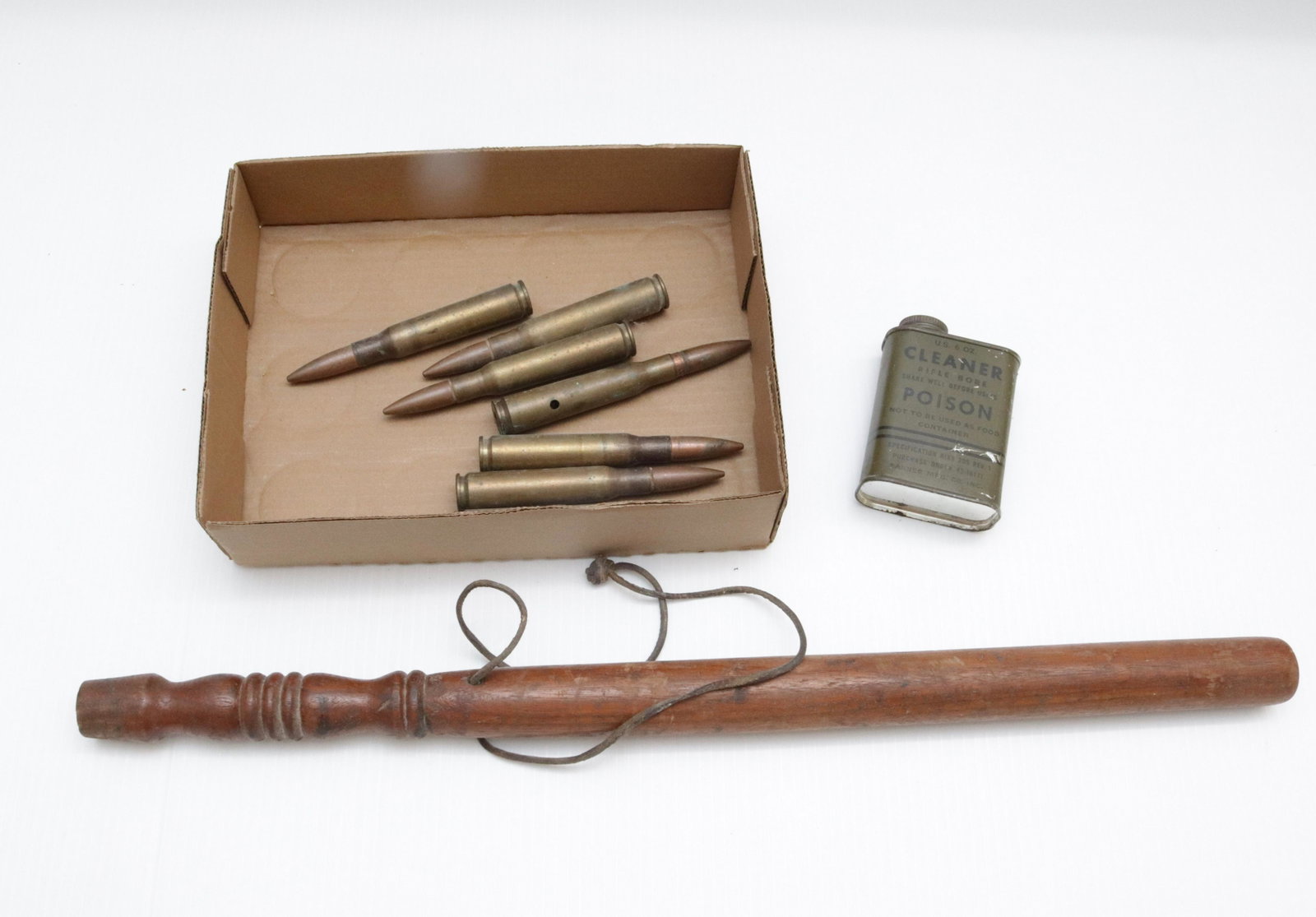 GUN RELATED LOT: TRENCH ART SHELLS, BILLY CLUB, AND GUN CLEANER