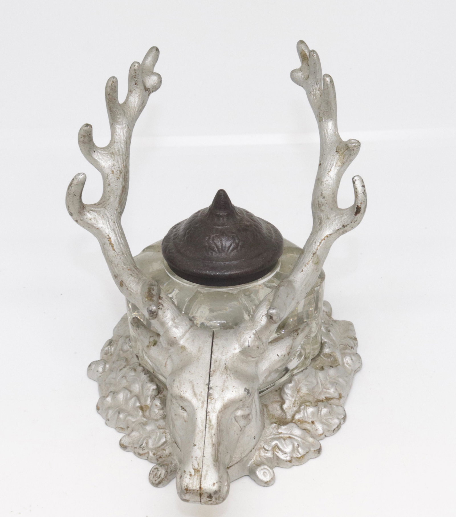CAST ALUMINUM INKWELL AND PEN HOLDER: STAG PAINTED SILVER. GLASS INK BOTTLE WITH CAST IRON LID 5" H