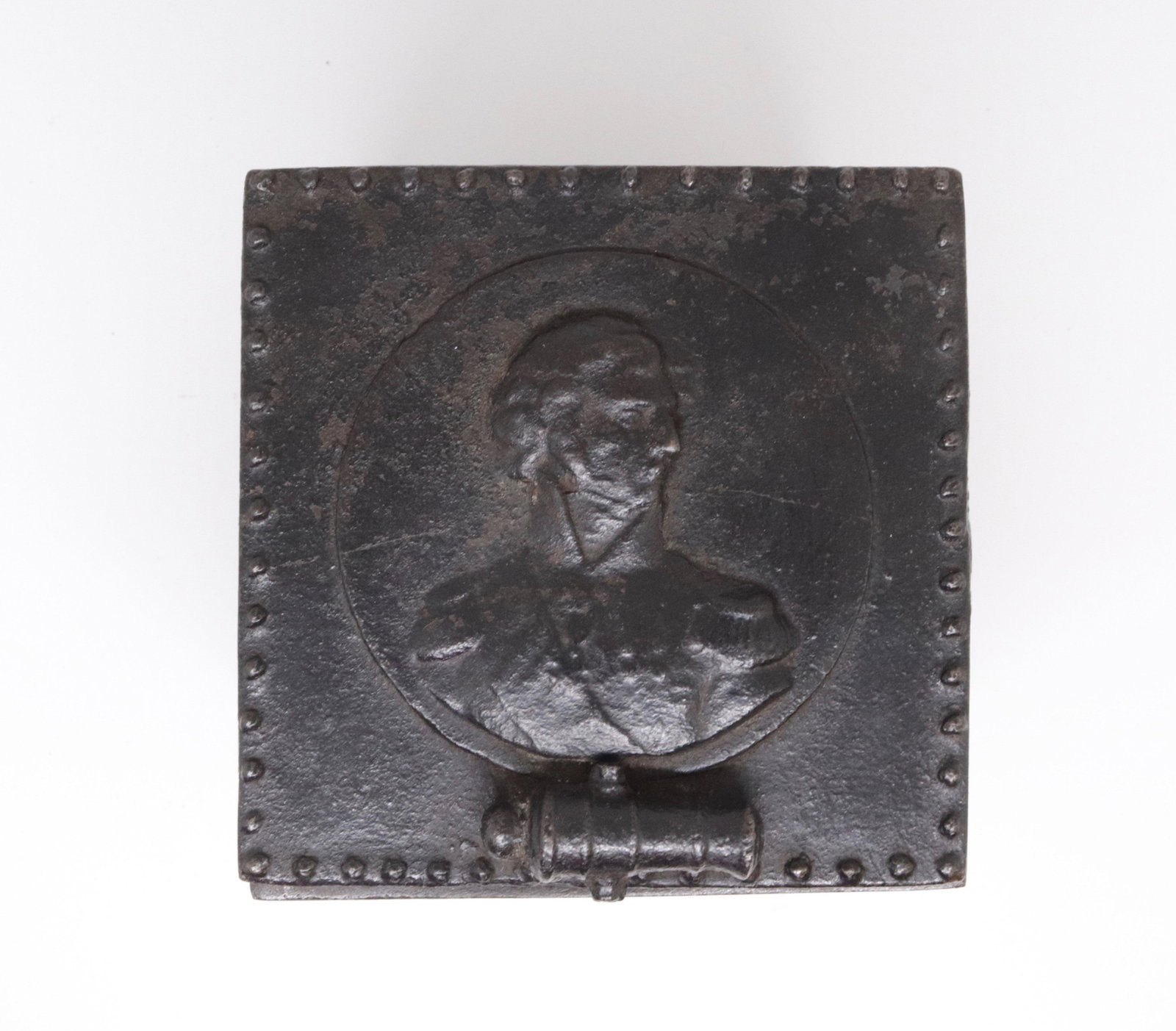 EARLY CAST IRON HORATIO NELSON TOBACCO BOX: DECORATED PANELS. CANNON LIFT ON LID. BLACK PAINT. 5" X 4.5" X 4.5"