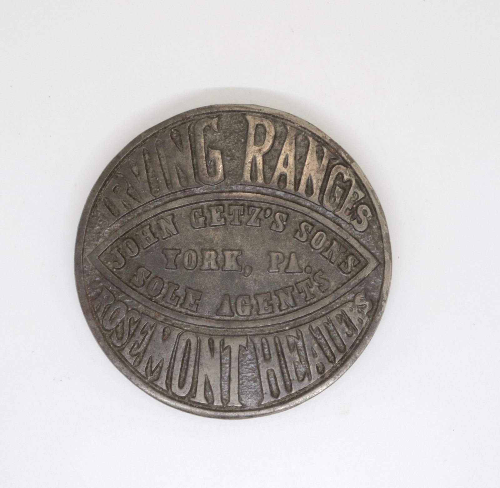 CAST IRON ADVERTISING TRIVET: IRVING RANGES, ROSEMONT HEATERS, JOHN GETZ'S SONS, YORK, PA 5.75" D