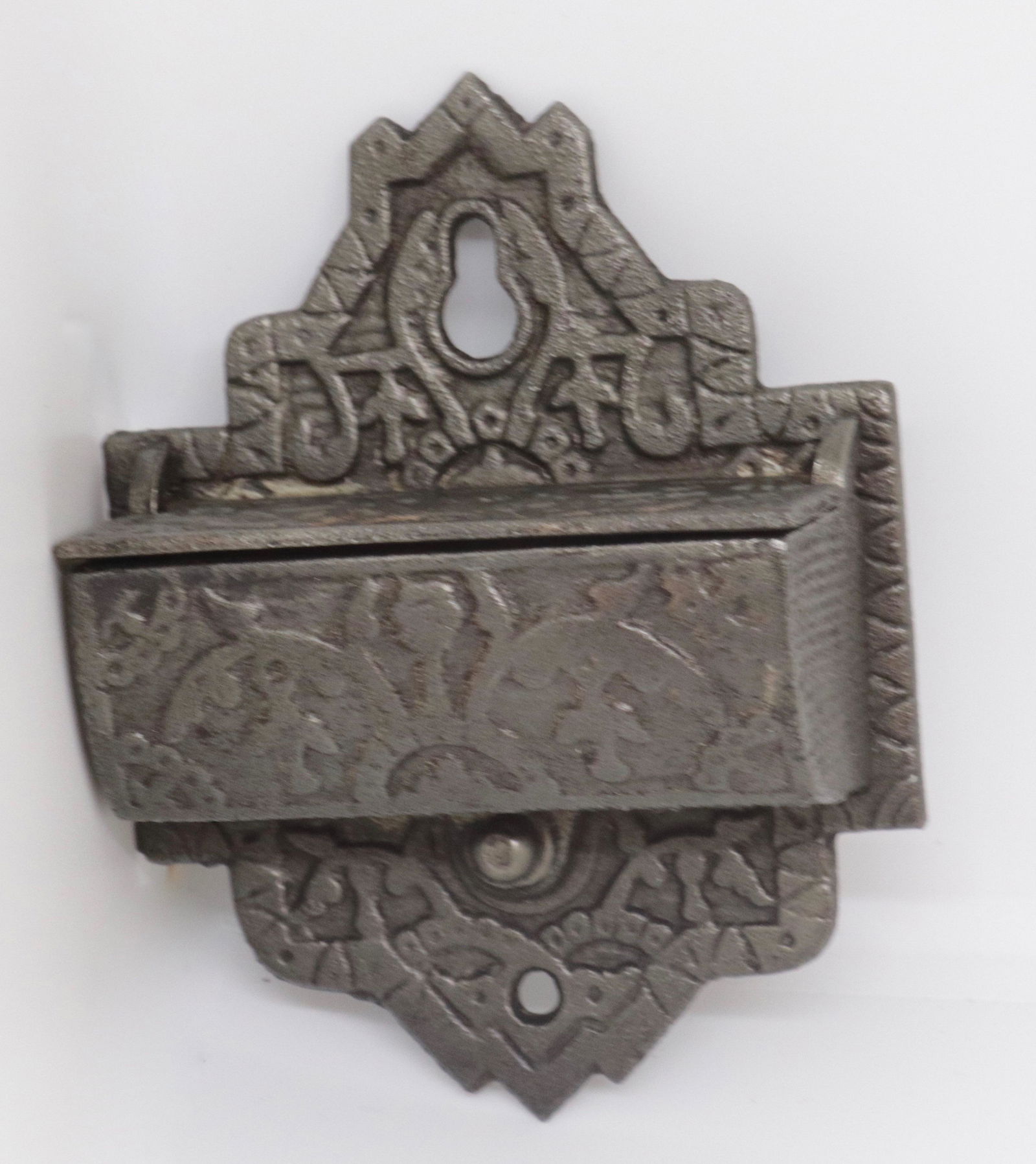 CAST IRON VICTORIAN MATCH SAFE: HANGING FORM WITH LIFT LID. EMBOSSED DECORATION 4.25" H