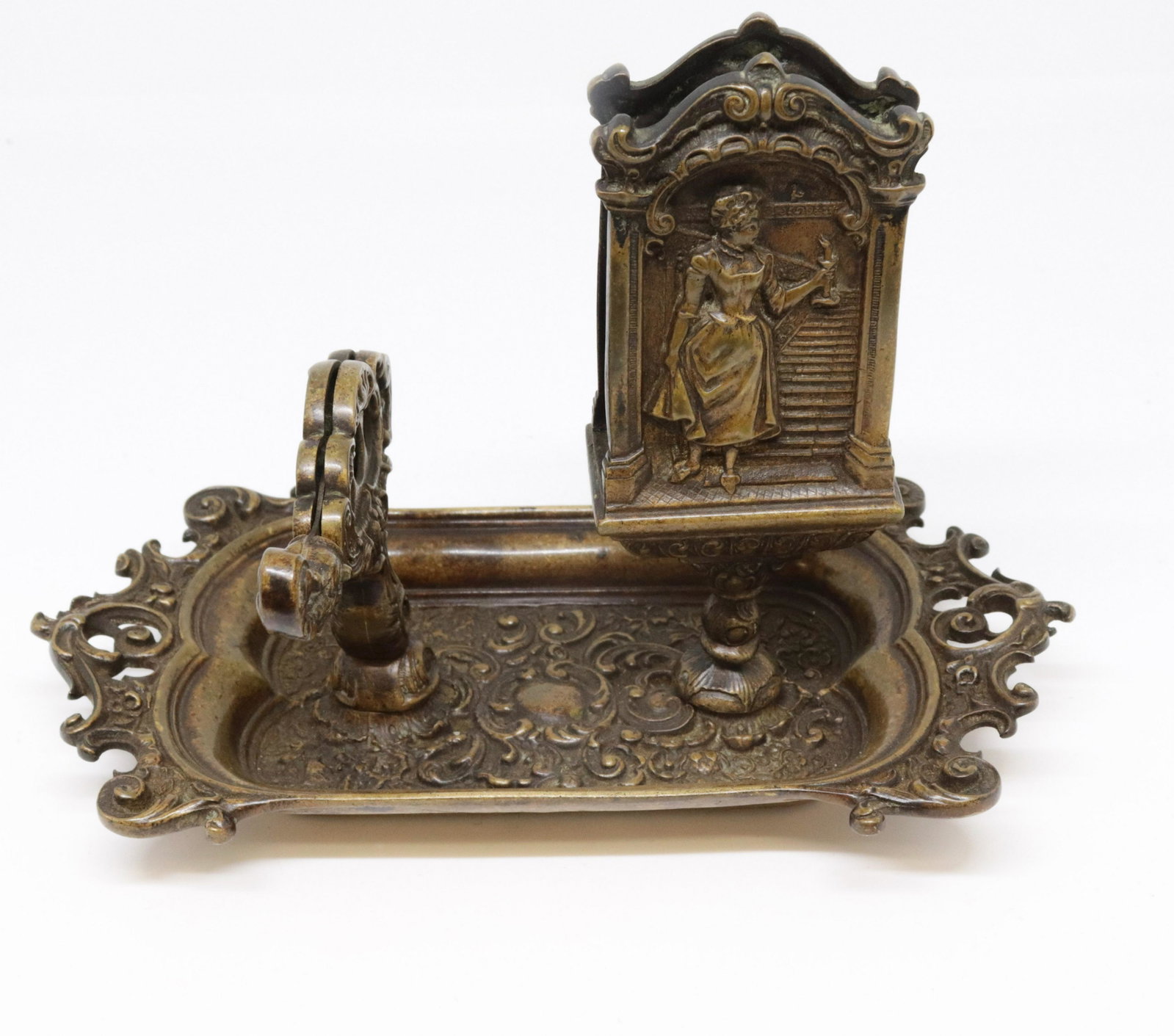 ANTIQUE BRONZE MATCH HOLDER AND CIGAR CUTTER: DEPICTS A MAN AND WOMAN. THREE SIZE CIGAR CUTTER. 5" H X 7.5" L