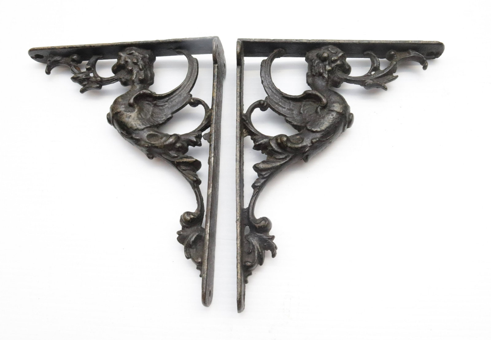 PAIR OF ANTIQUE SHELF BRACKETS: GRIFFIN MOTIF. PAINTED SURFACE. 9.5" X 7.5"