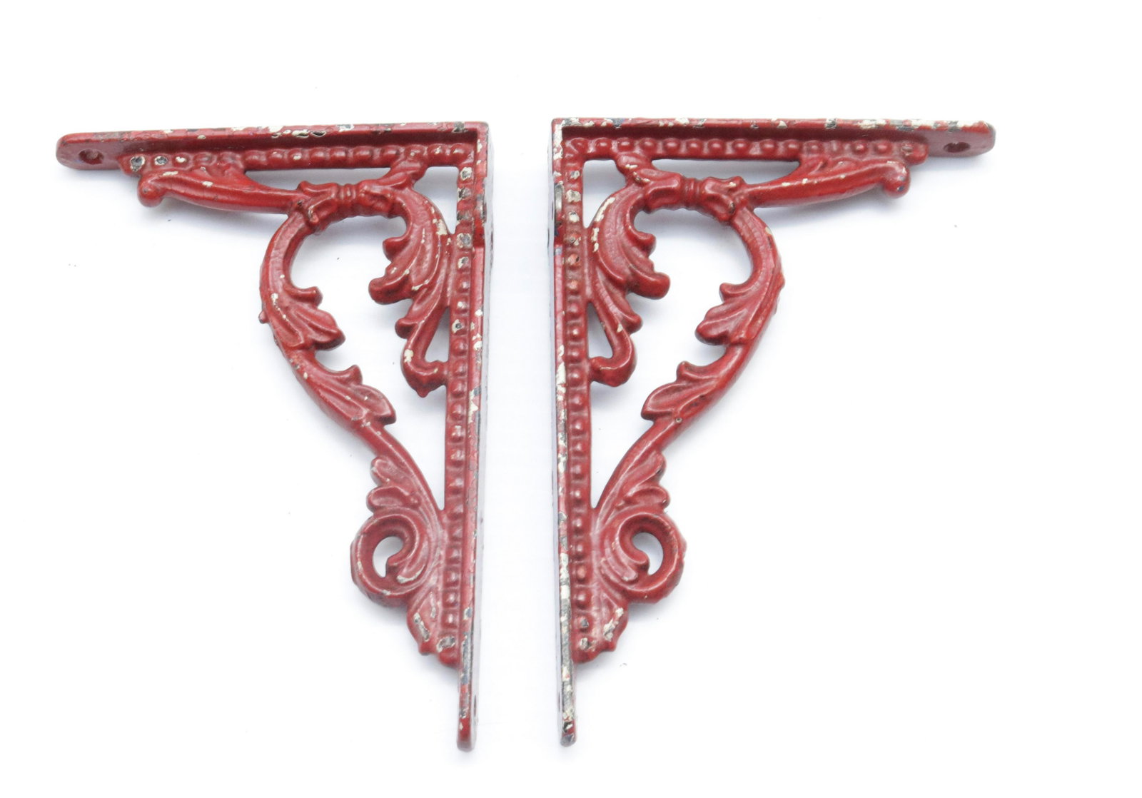 PAIR OF CAST IRON SHELF BRACKETS: RED PAINTED SURFACE 6.5" X 4.75"