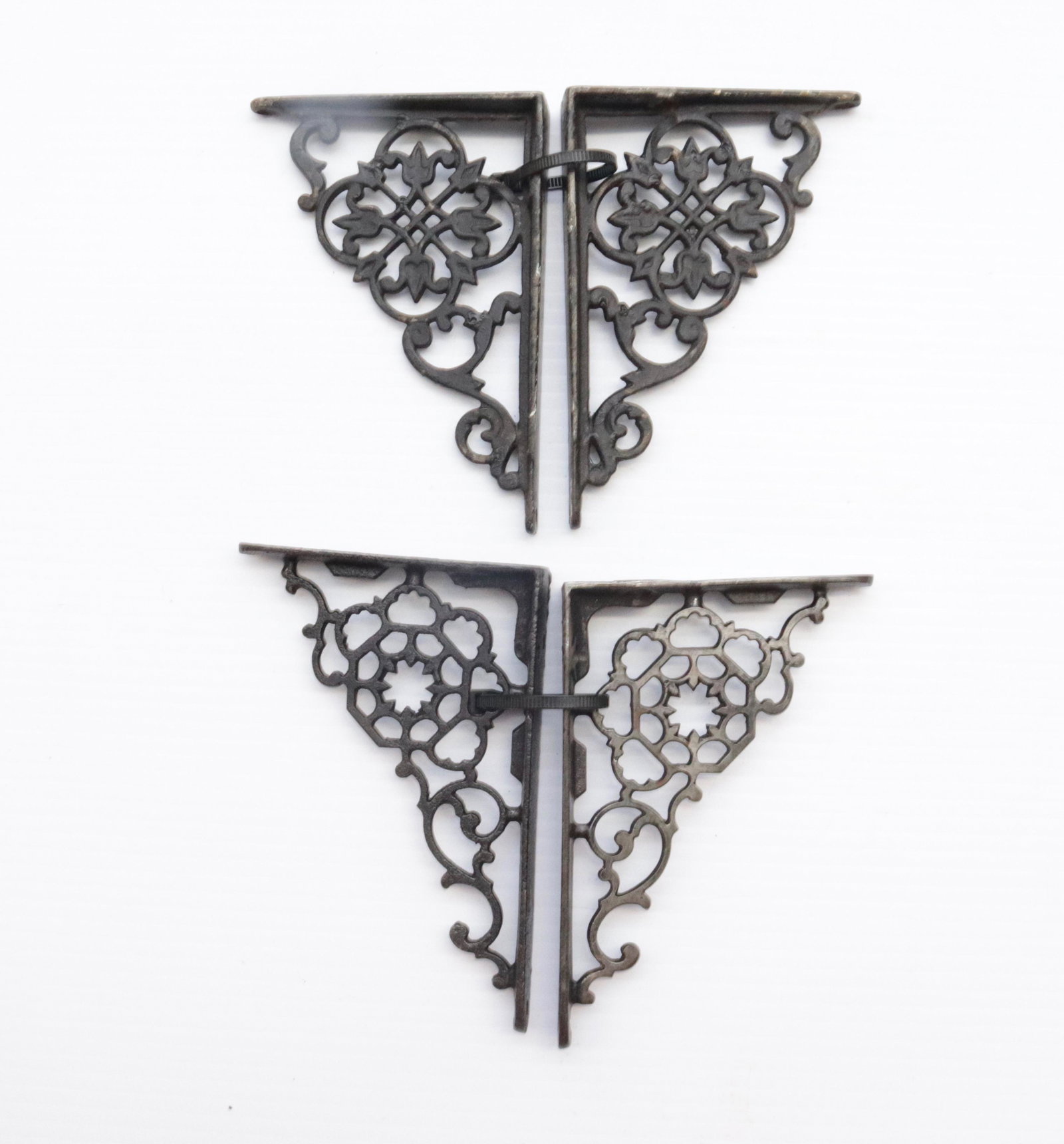 FOUR CAST IRON SHELF BRACKETS: TWO PAIR 5.5" X 4" AND 5.75" X 4"