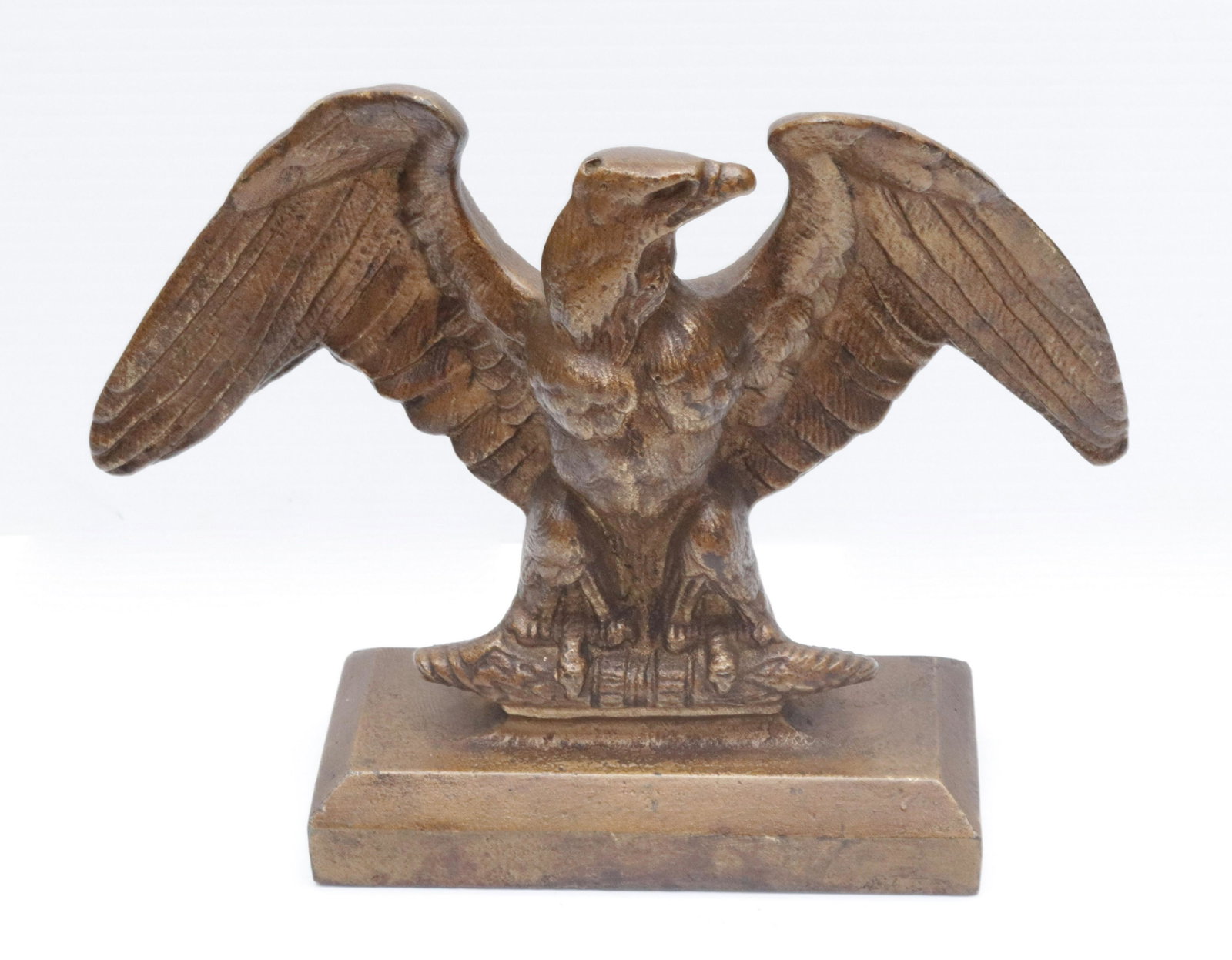 CAST IRON EAGLE DOORSTOP: GOLD PAINTED SURFACE. MRKD. B.S. CO. ON BACK 7" H X 9" W