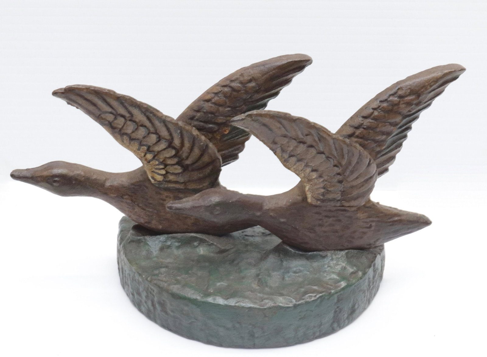 CAST IRON GOOSE DOORSTOP: TWO FLYING GEESE ON BASE 5.25" H X 10" W