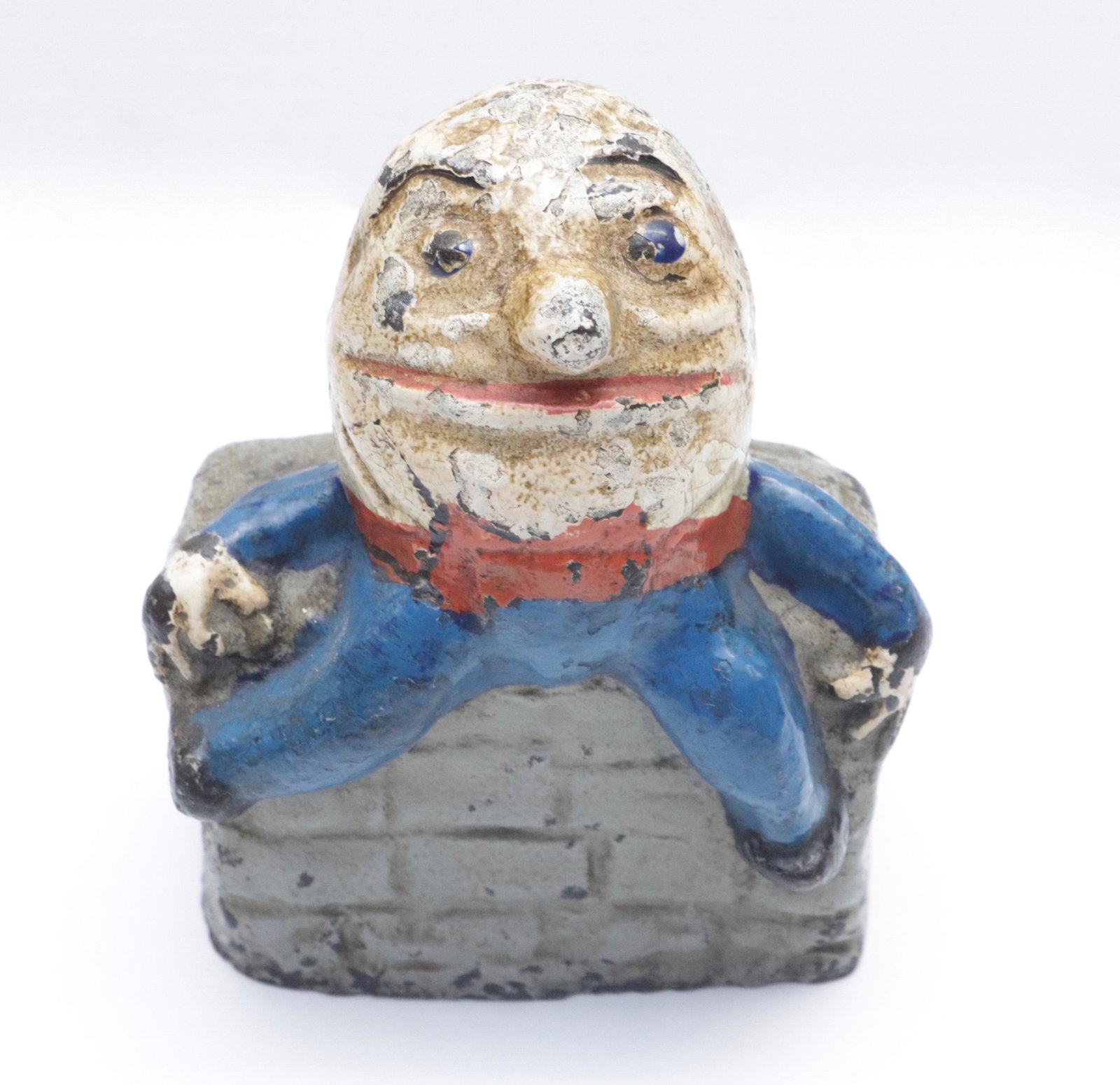 CAST IRON HUMPTY DUMPTY DOORSTOP: PAINTED SURFACE. NUMBERED 199 ON INSIDE 4.25" X 3.25"
